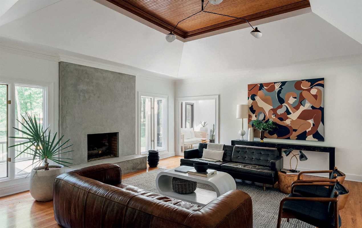 Living space featuring ‘Young Visionaries: A New Generation of Interior Designers' by Beta Plus as a coffee table book.