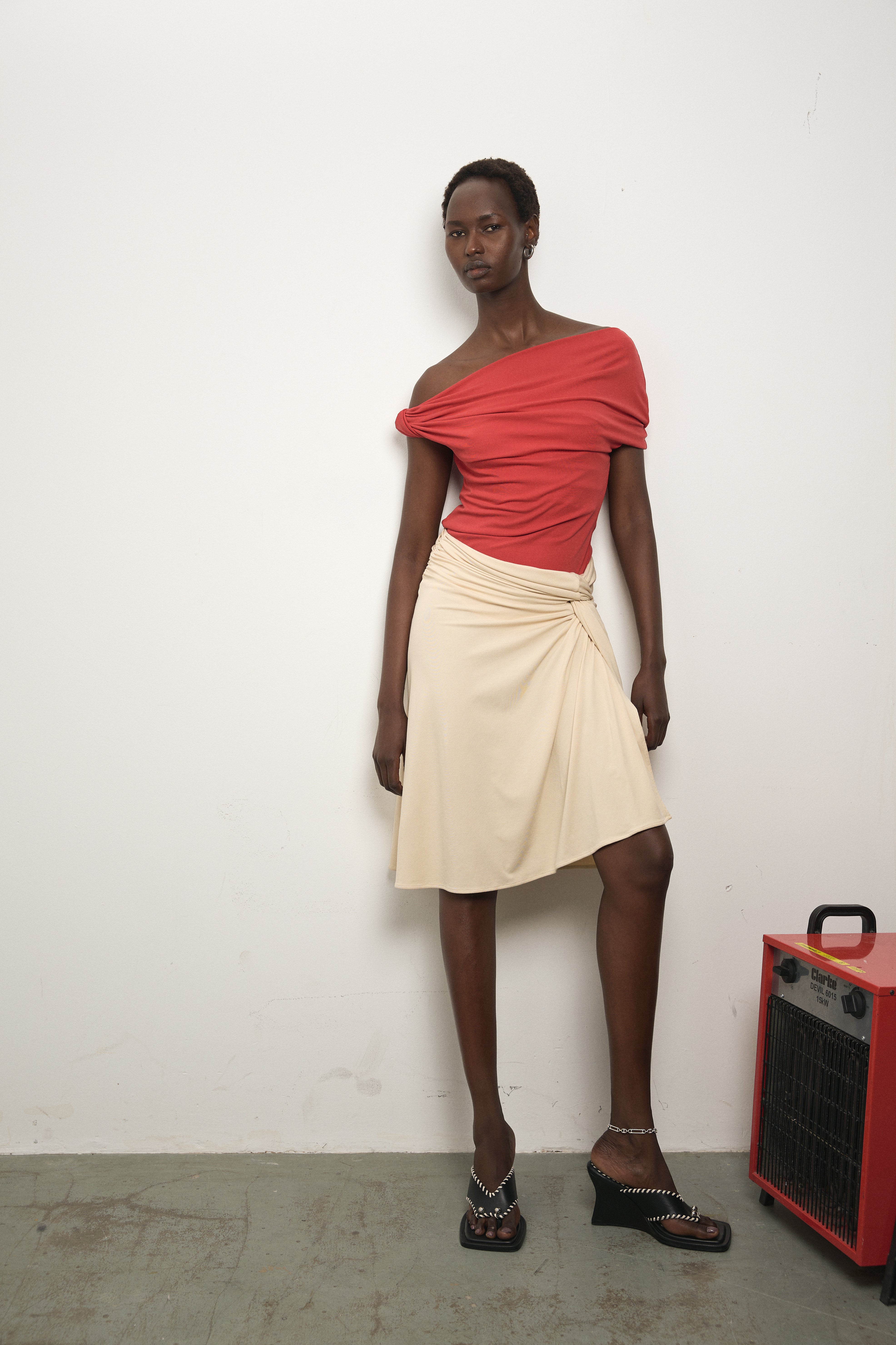 Model wearing Paris Georgia Ida Top in red