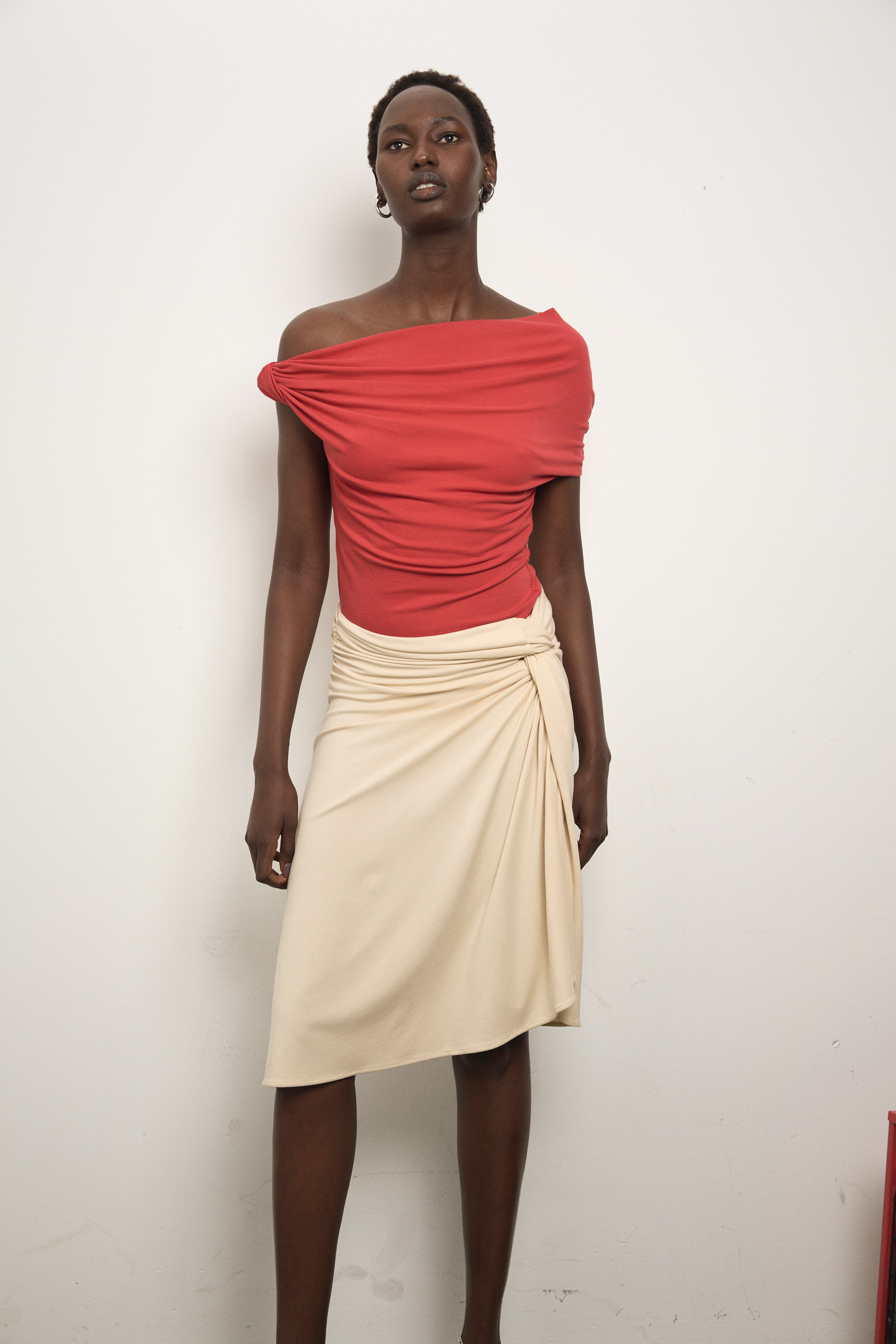 Model wearing Paris Georgia Ida Top in red