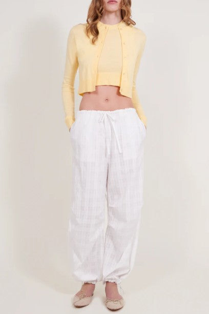 image of a model wearing the Alfie Grace Pant in white checkered