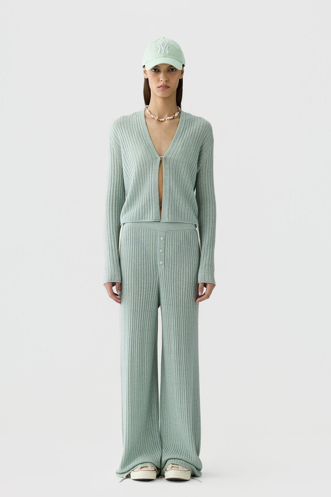 image of a model wearing the Guest in Residence Rib Stealth Cardigan in Sage Brush