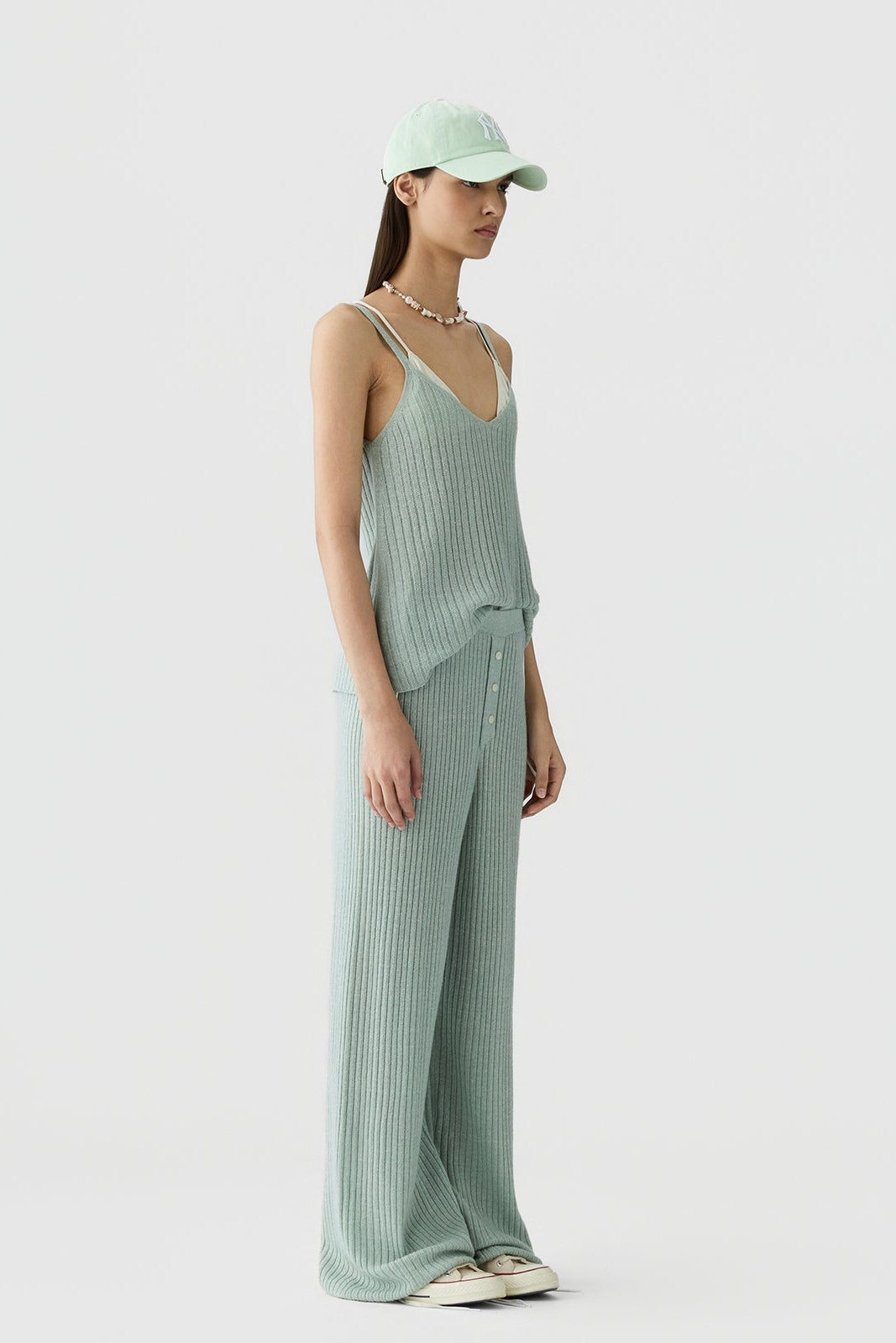 image of a model wearing the Guest in Residence Breezy Rib Tank in Sage Brush