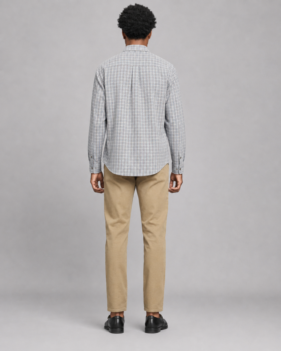 Backside of a man modeling a Billy Reid Twill Plaid Hutcheson Sport Shirt standing against a white background