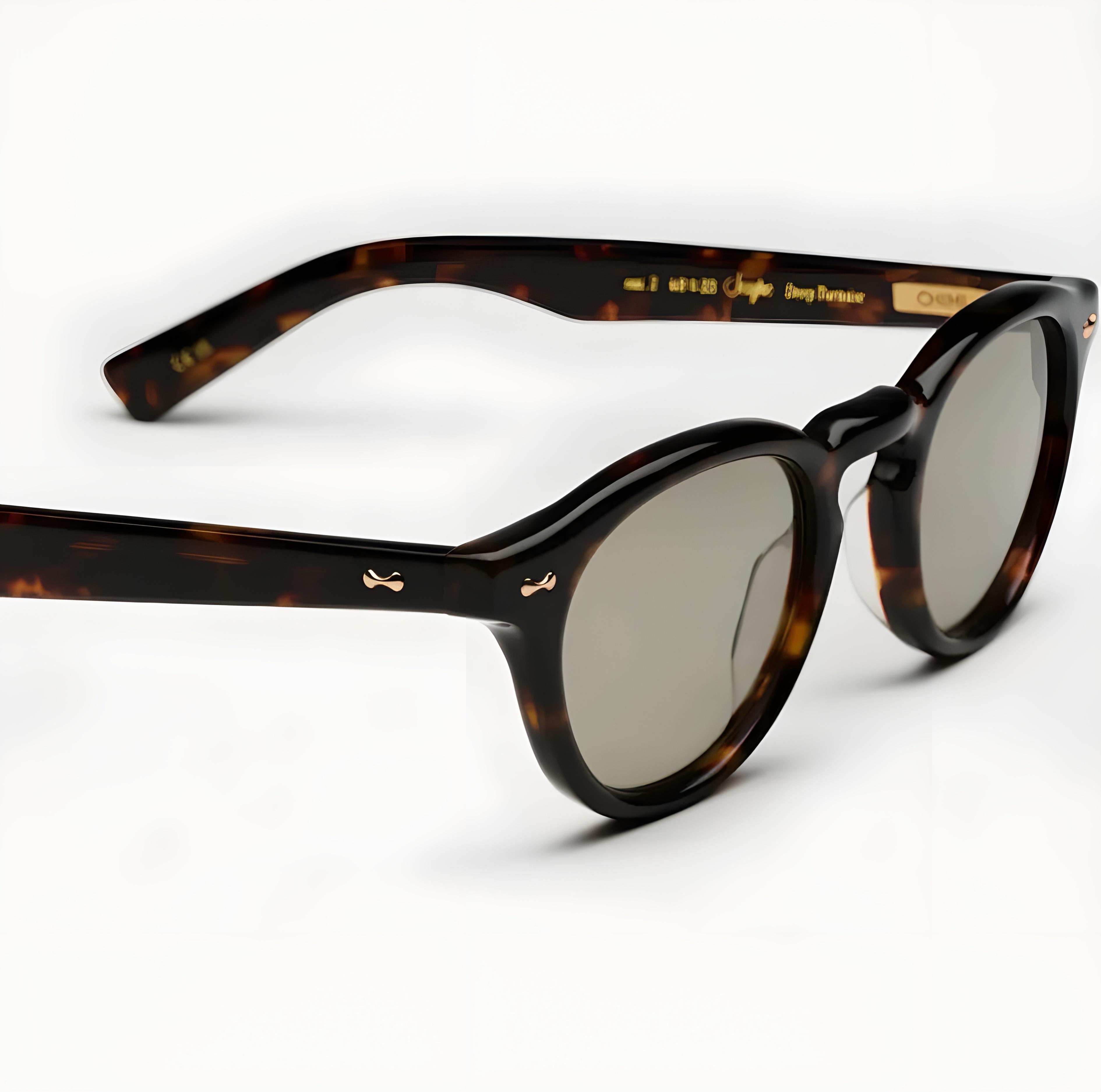 Tortoiseshell sunglasses with dark lenses on a white background