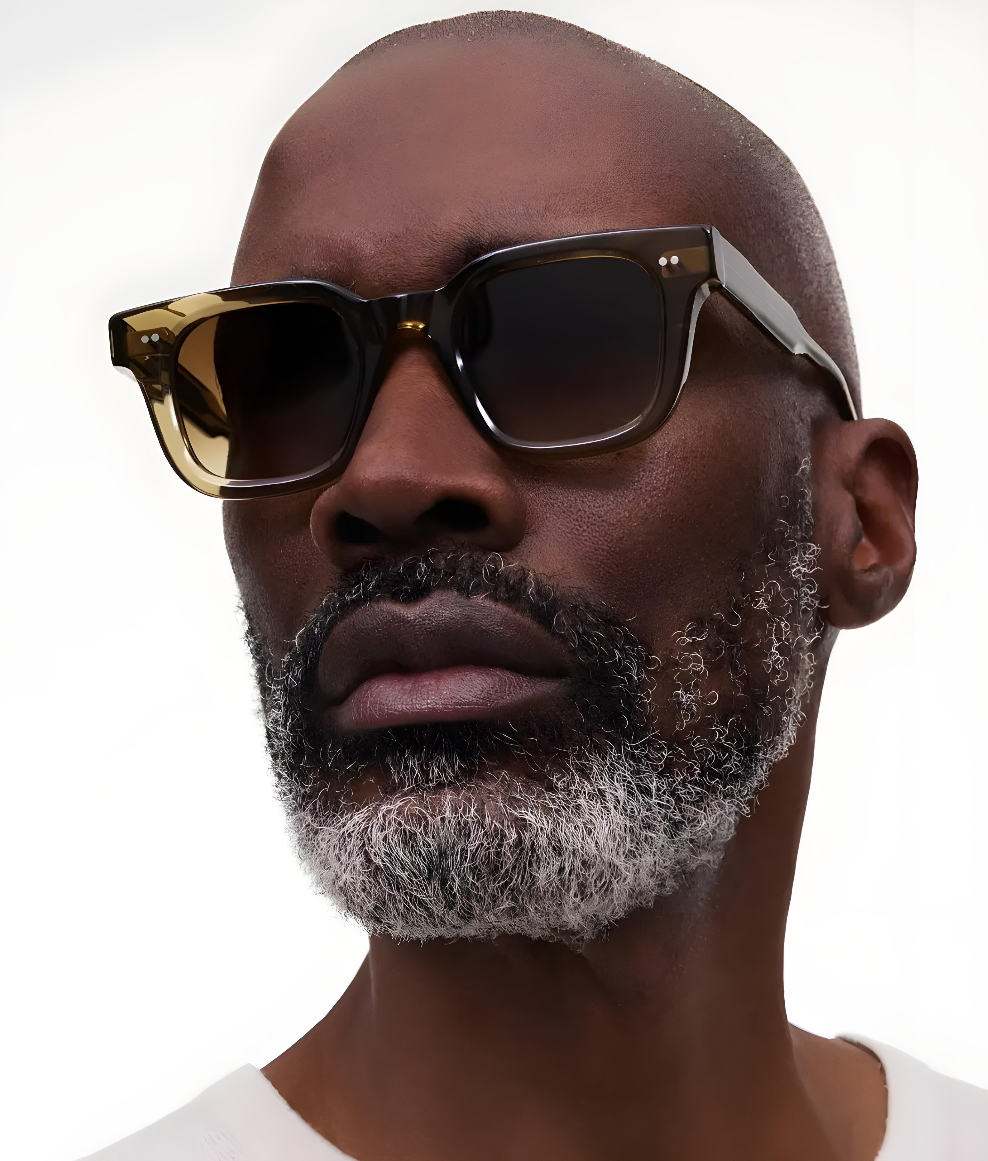 Man wearing Chimi Sunglasses Core 4, Green with a neutral background