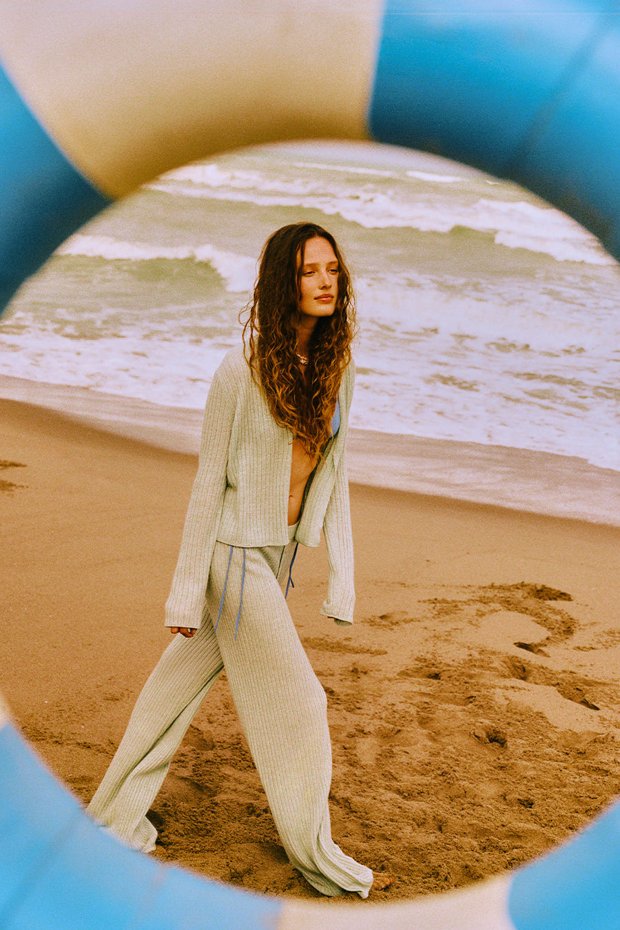 image of a model wearing the Guest in Residence Rib Stealth Cardigan in Sage Brush