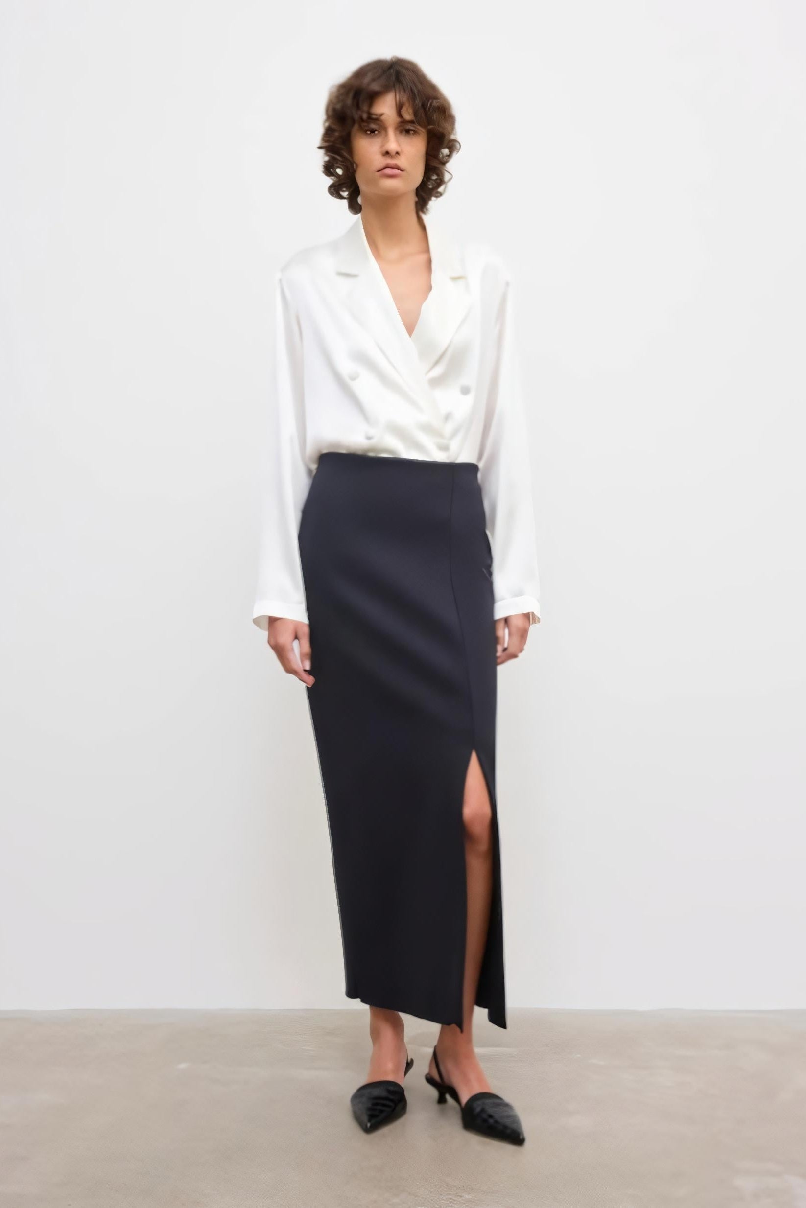 image of a model wearing the House of Dagmar Fitted Midi Skirt