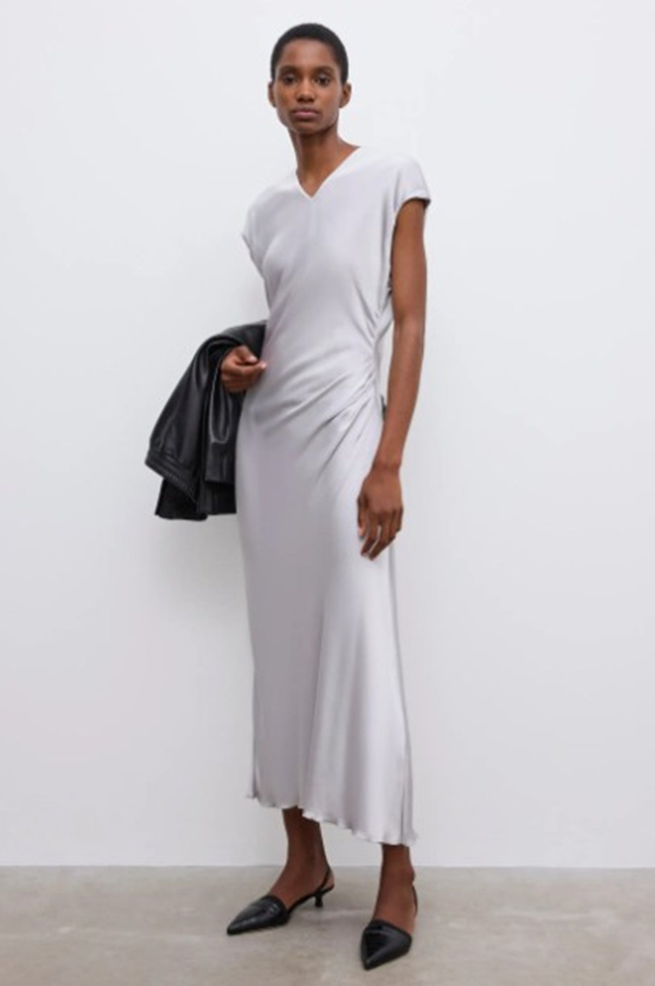 Image of a model wearing the House of Dagmar Fluid V Dress in Silver