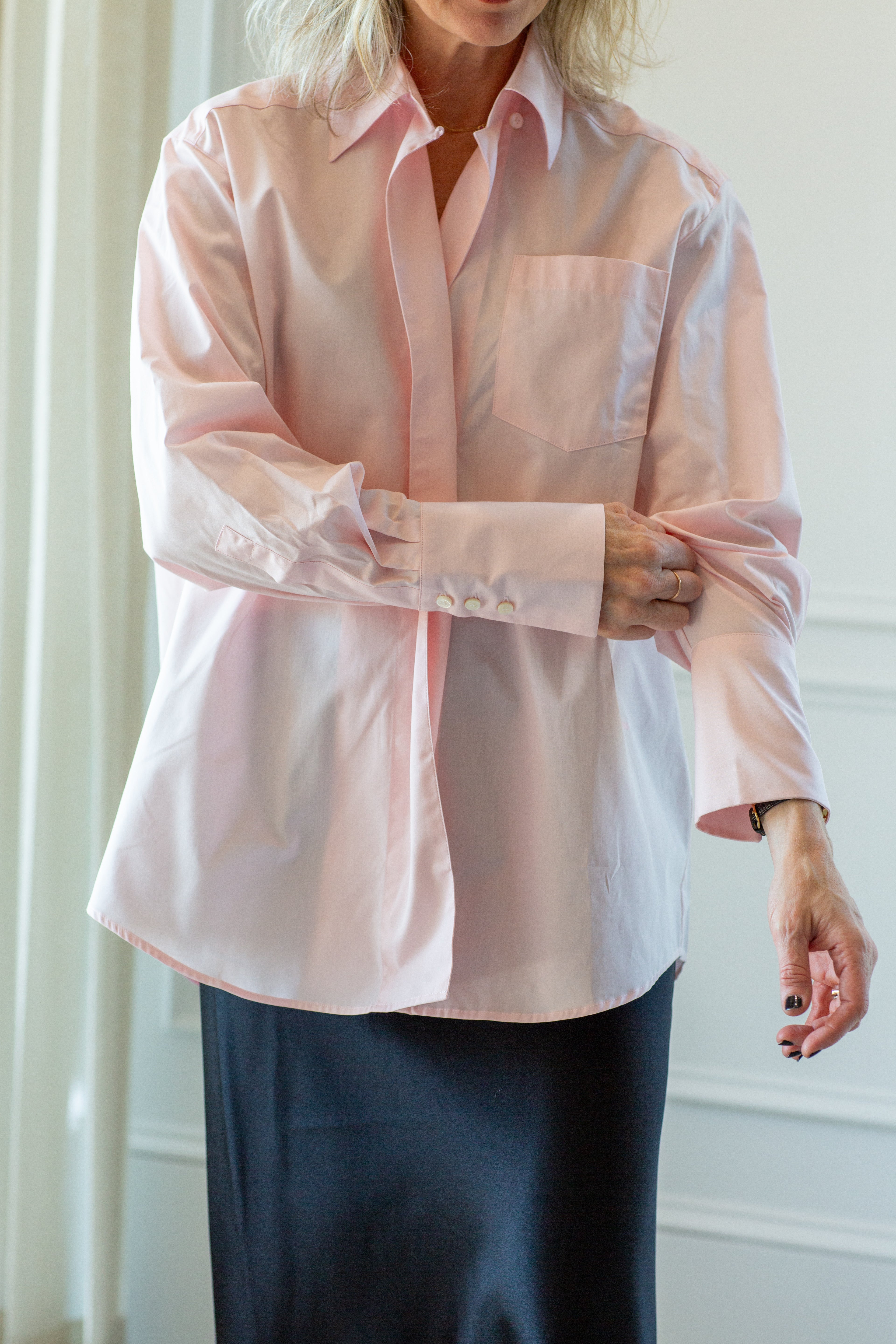 model wearing the house of dagmar asymmetrical shirt in pink