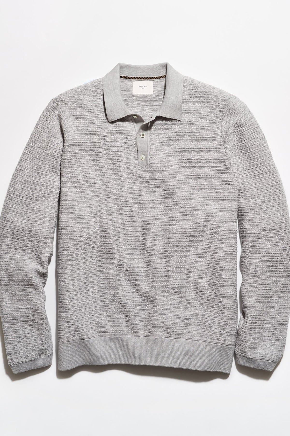 A light gray ribbed knit polo sweater with a three-button placket, laid flat against a clean white background.