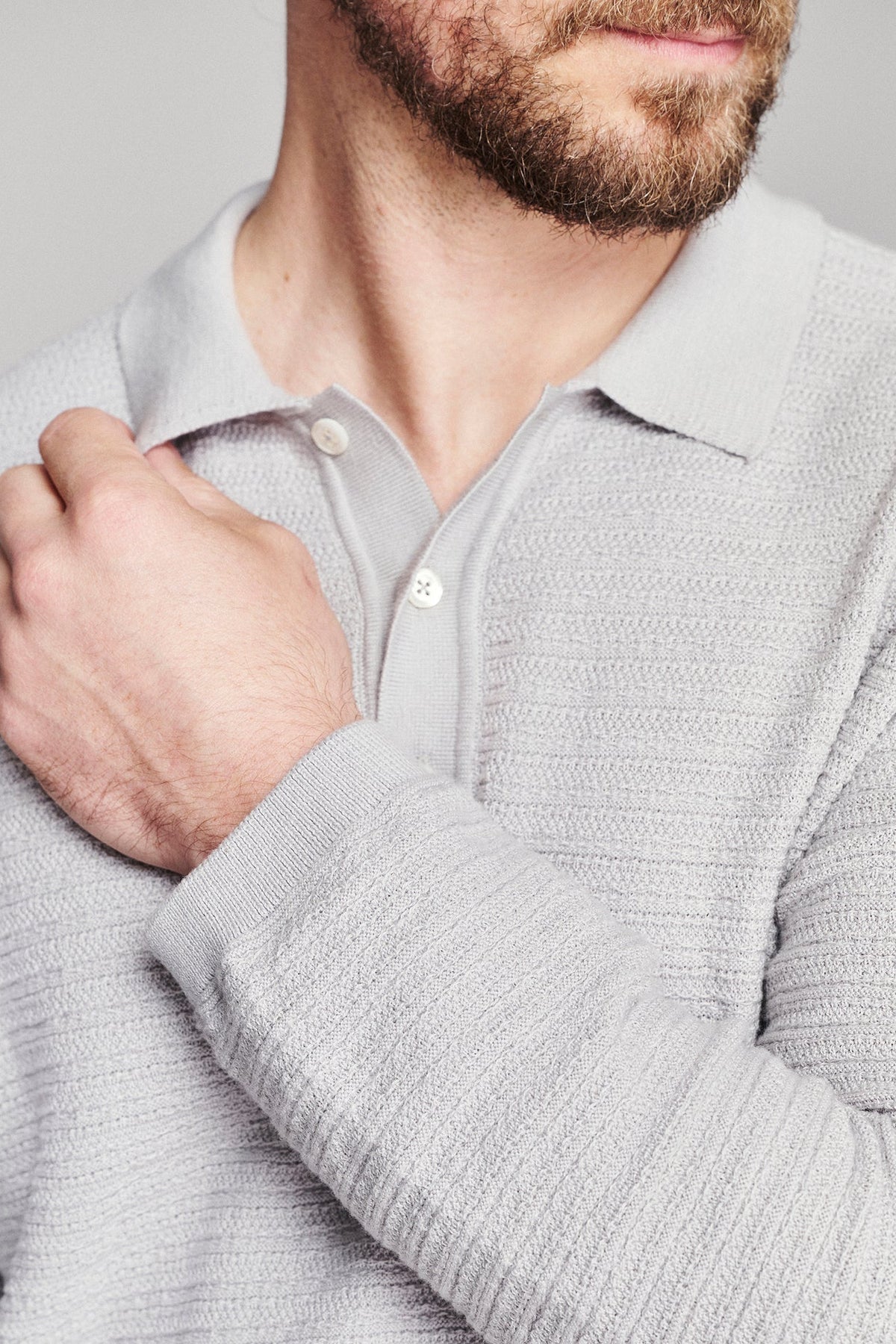 Billy Reid Long Sleeve Lachlan Links Polo in light grey cotton, close detail of the knit collar, placket and sleeve texture