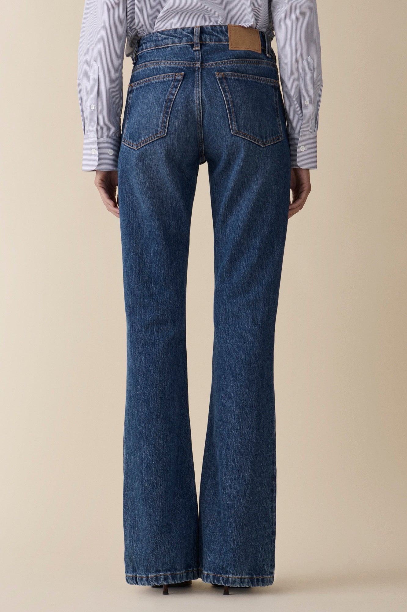 back image of a woman wearing the Jeanerica Moda Jeans in Fresco Blue