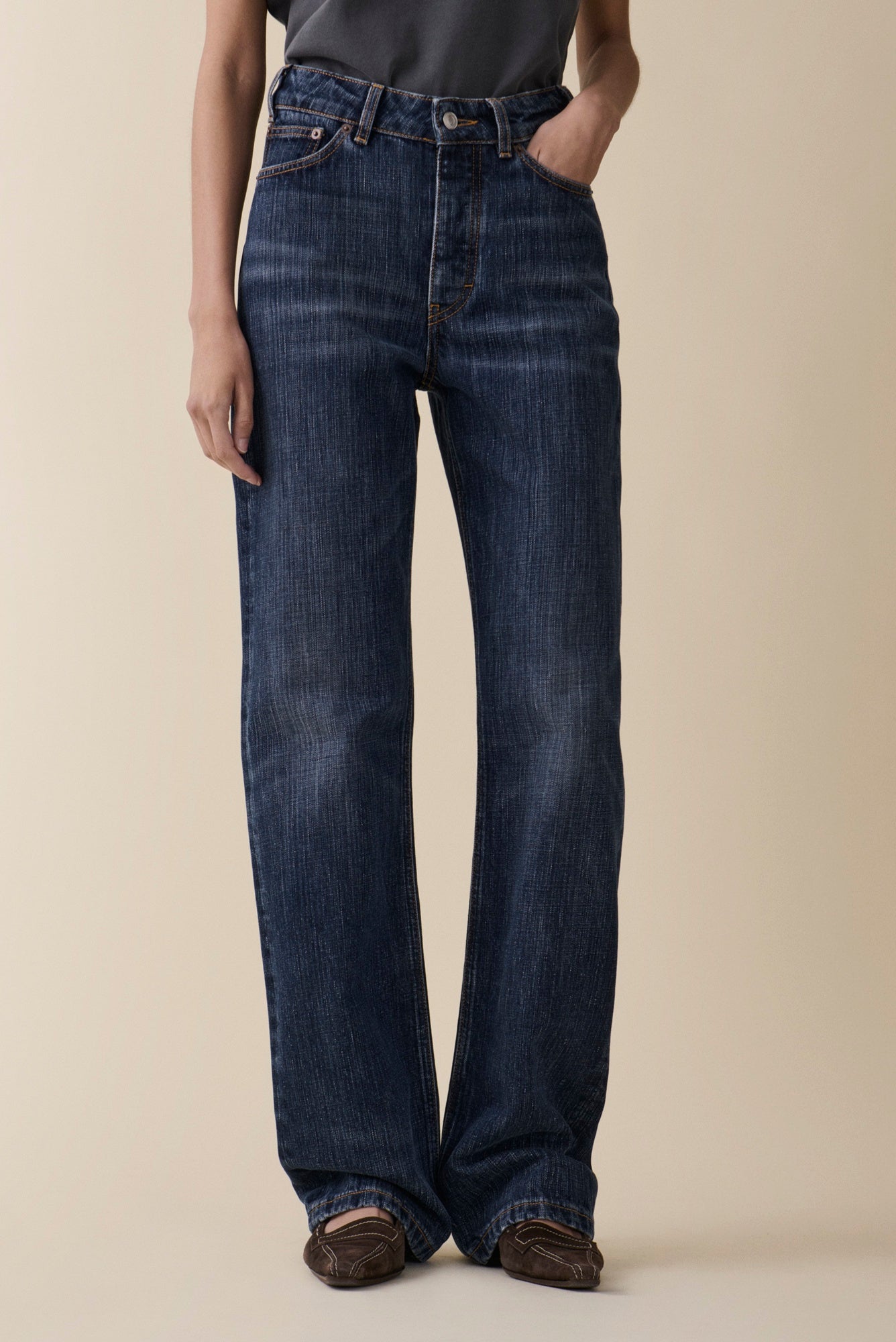 image of a model wearing the Jeanerica Virgo Jeans in Dark Blue Righe