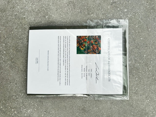 Certificate of Authenticity for a painting on a gray surface