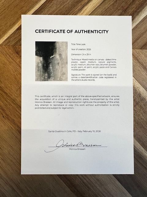 Certificate of Authenticity on a wooden surface