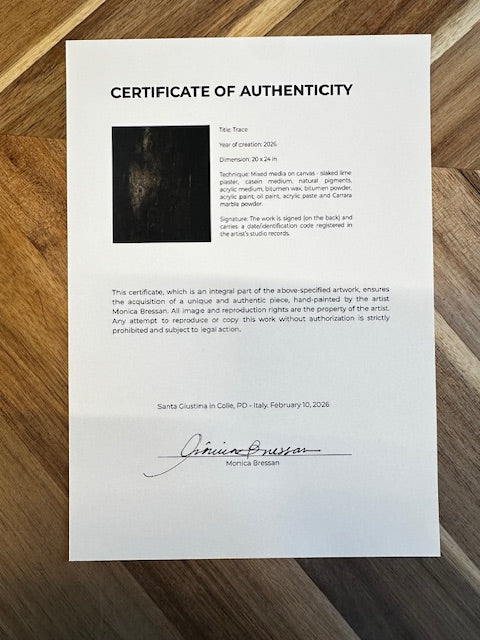 Certificate of Authenticity on a wooden surface