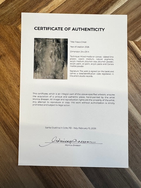 Certificate of Authenticity on a wooden surface