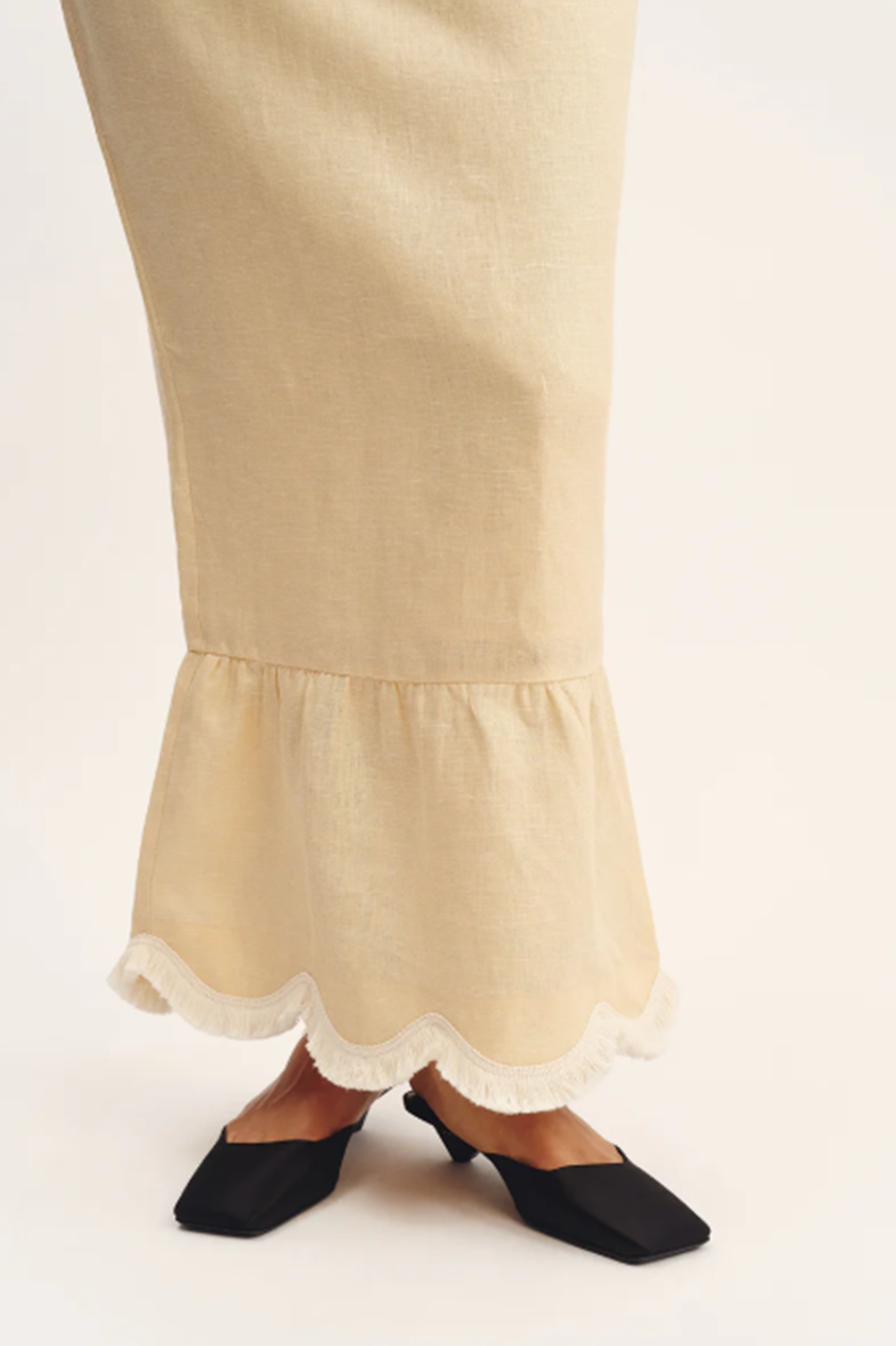 woman wearing a dress with the bottom lace detail