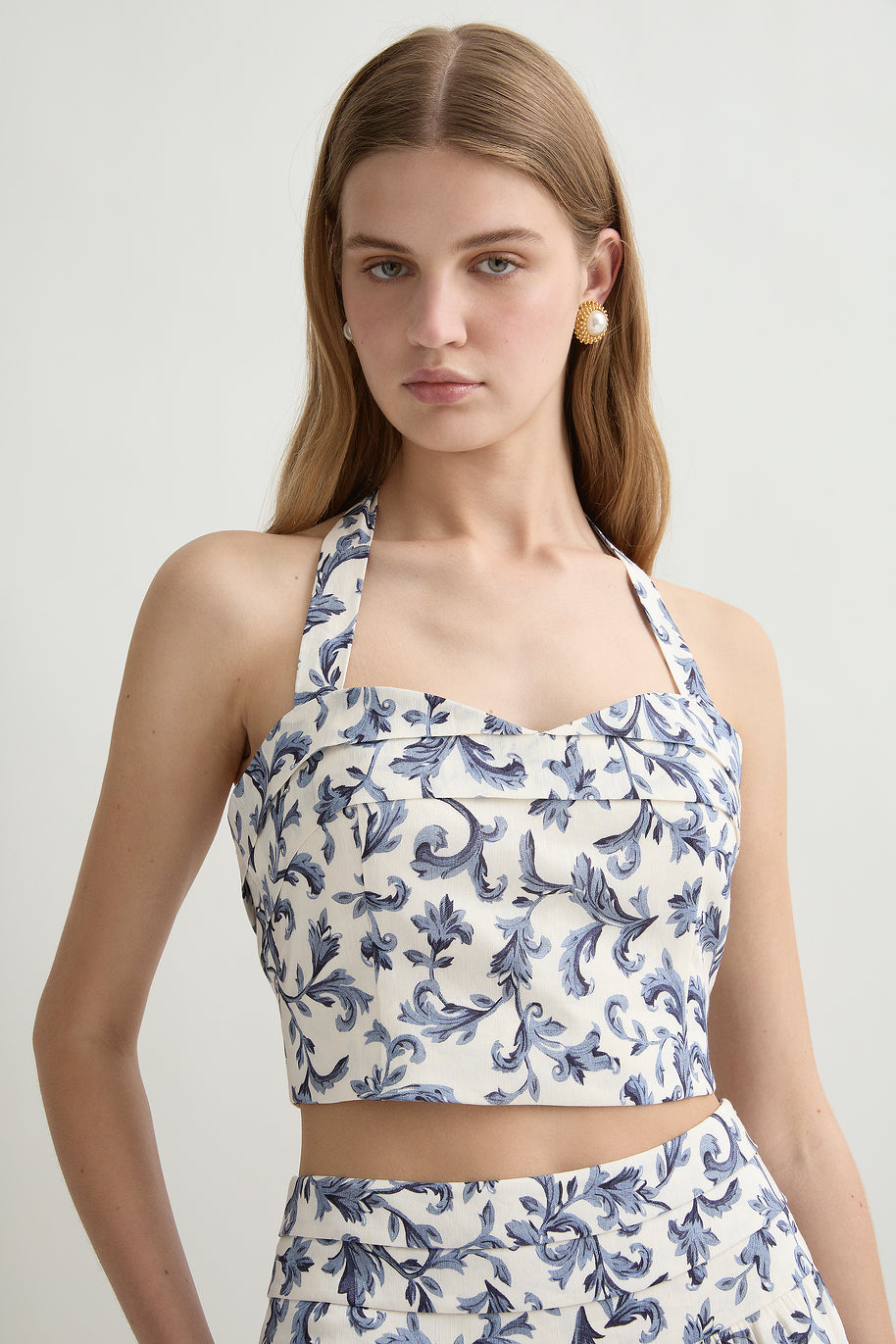 image of a woman wearing the Posse Rue Halter Top