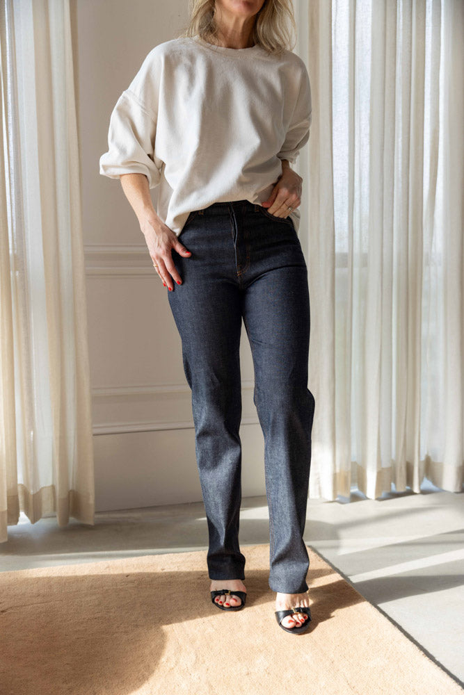 Dagmar Straight Leg Denim in raw blue organic cotton, worn front view showing the mid rise and straight leg