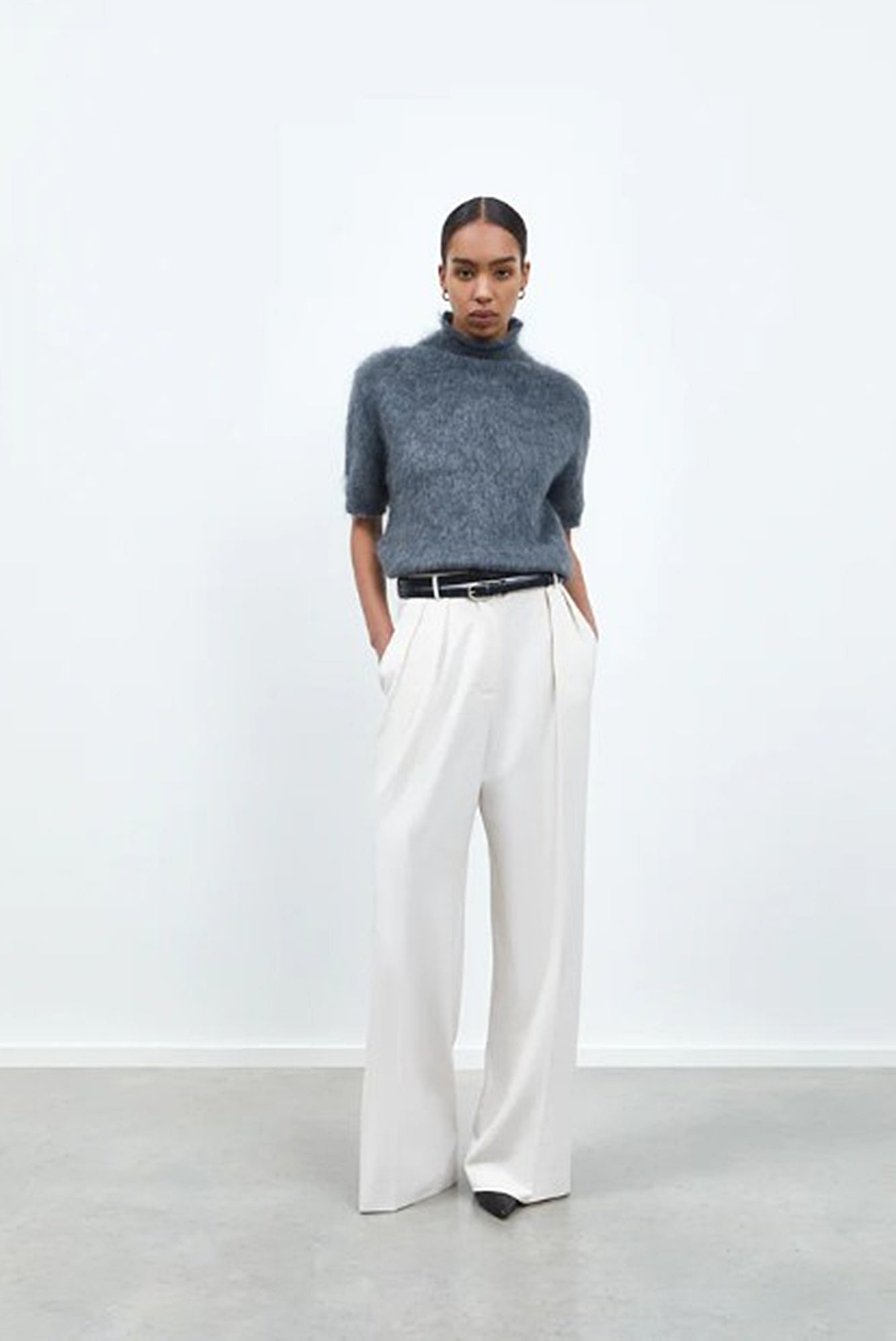 image of a model wearing the Rhune Celine Pants in White