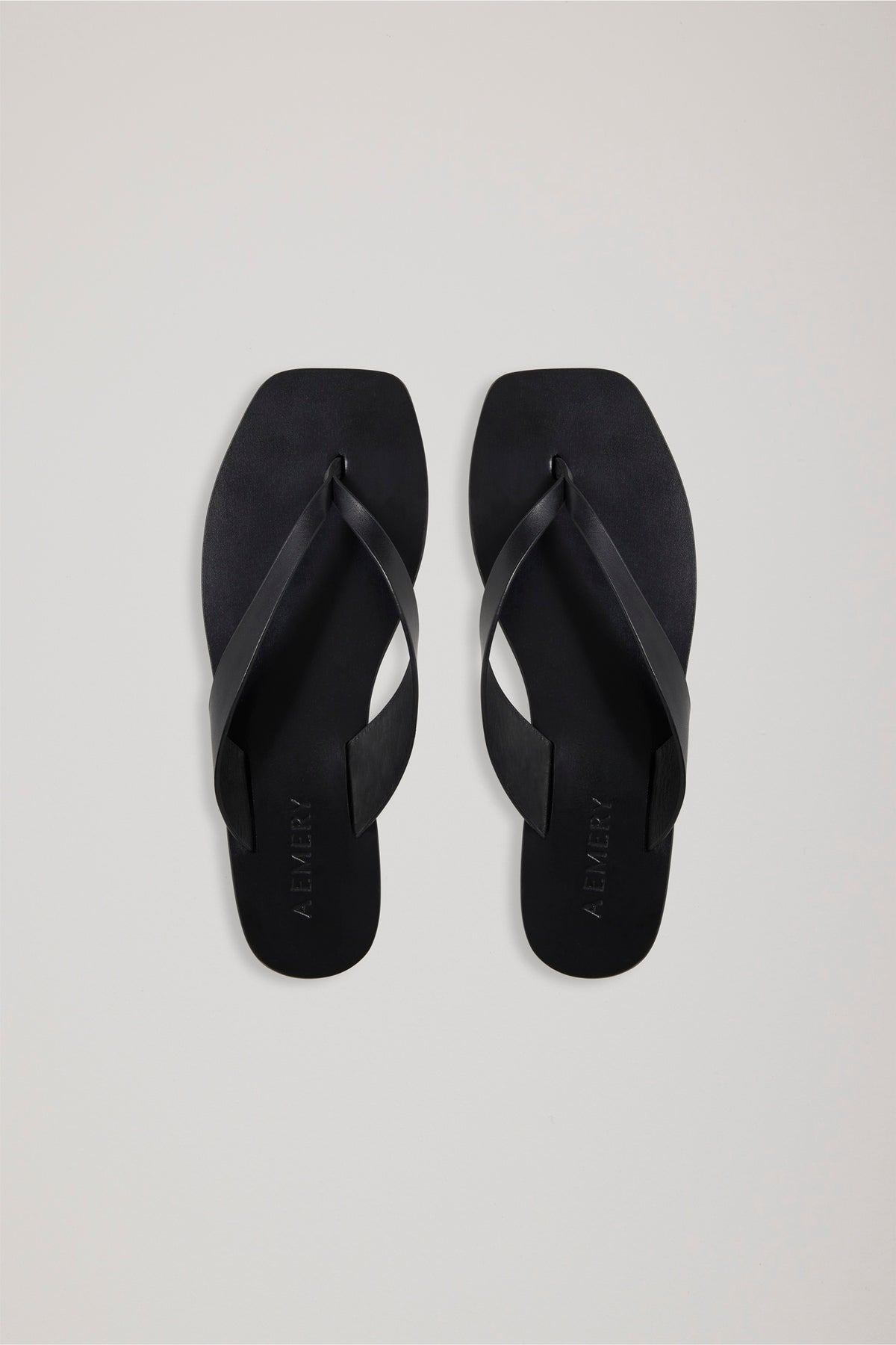 A Emery Kinto Sandal in Black against a white background