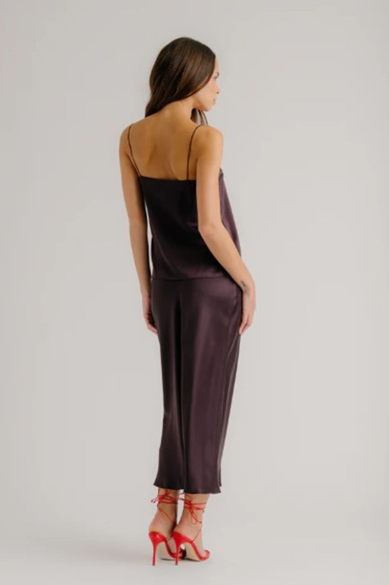 back image of a woman wearing the Sablyn Miranda B Silk Skirt in Oak Tree