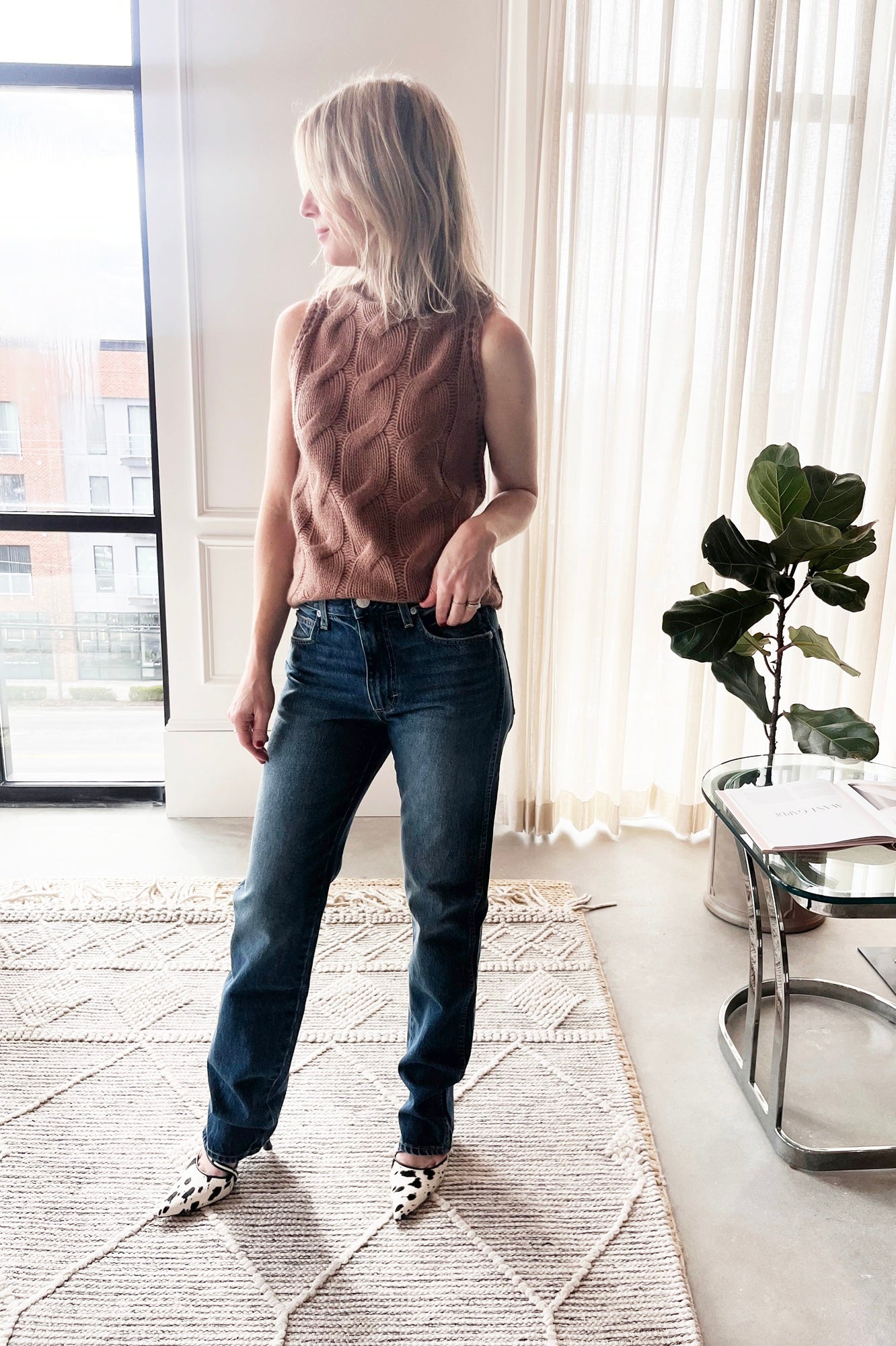image of a woman wearing the Sablyn Salvia Sweater and Amo Mira Jeans