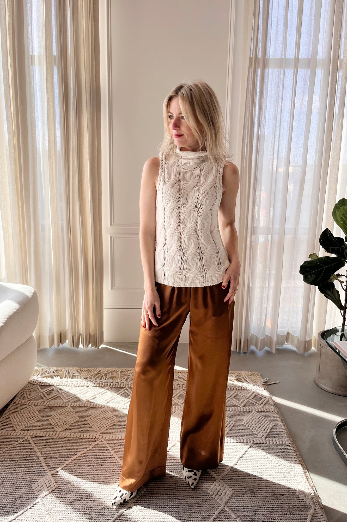 image of a woman wearing the Sablyn Salvia Sweater and Brynn Silk Pants