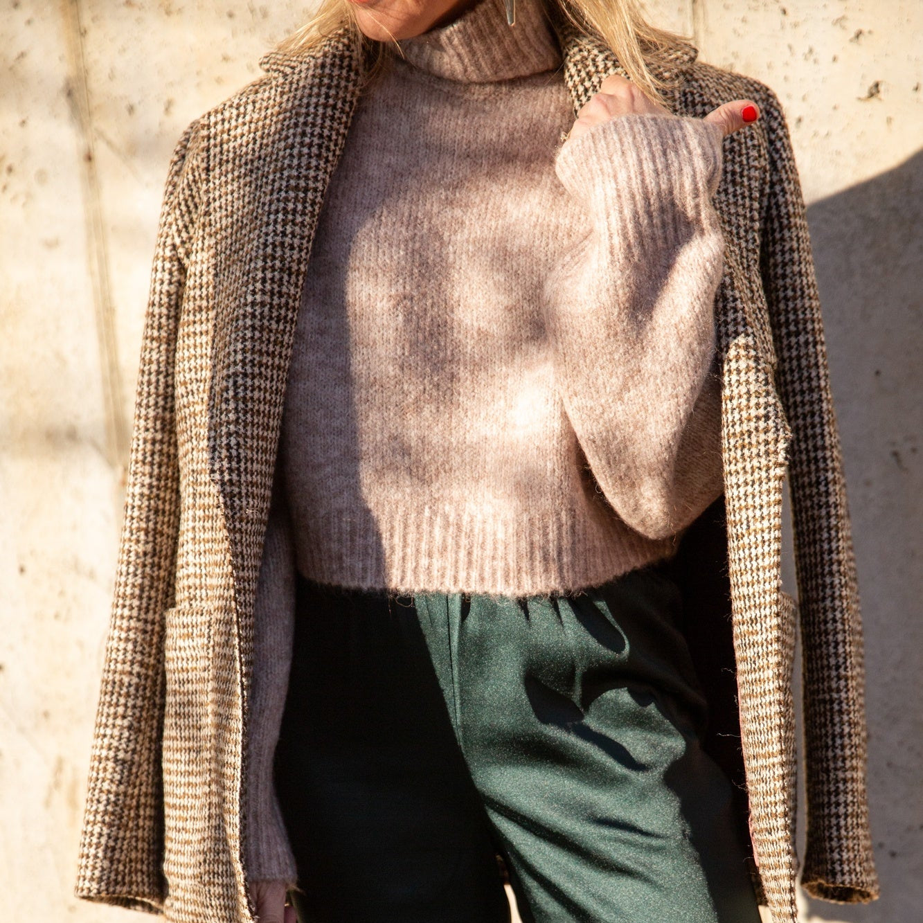 image of a model wearing the Seroya Tahara Sweater, House of Dagmar Tweed Coat, Seroya Viva Satin Pants and Aesther Ekme Handbag