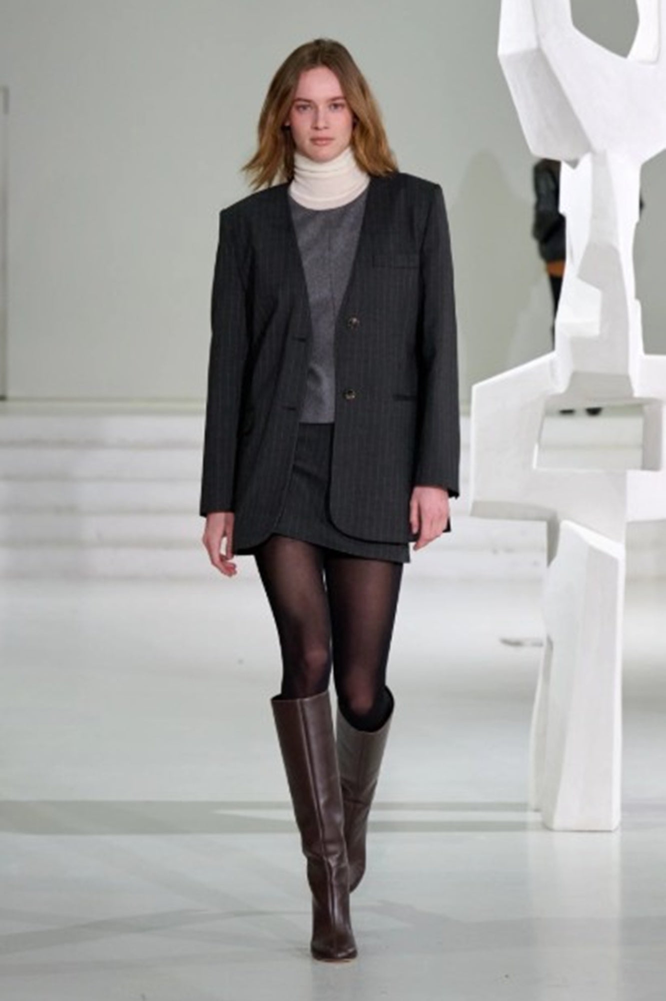 A model on the runway for the Garment AW25 runway show wearing the mitch top