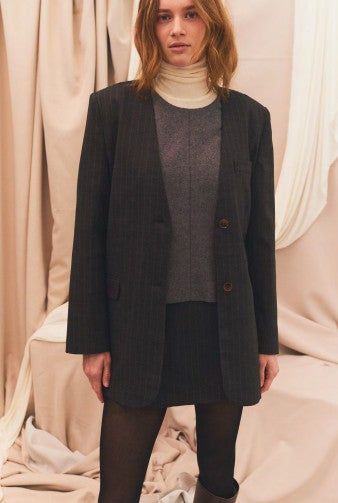 A model wearing the Garment Mitch Top