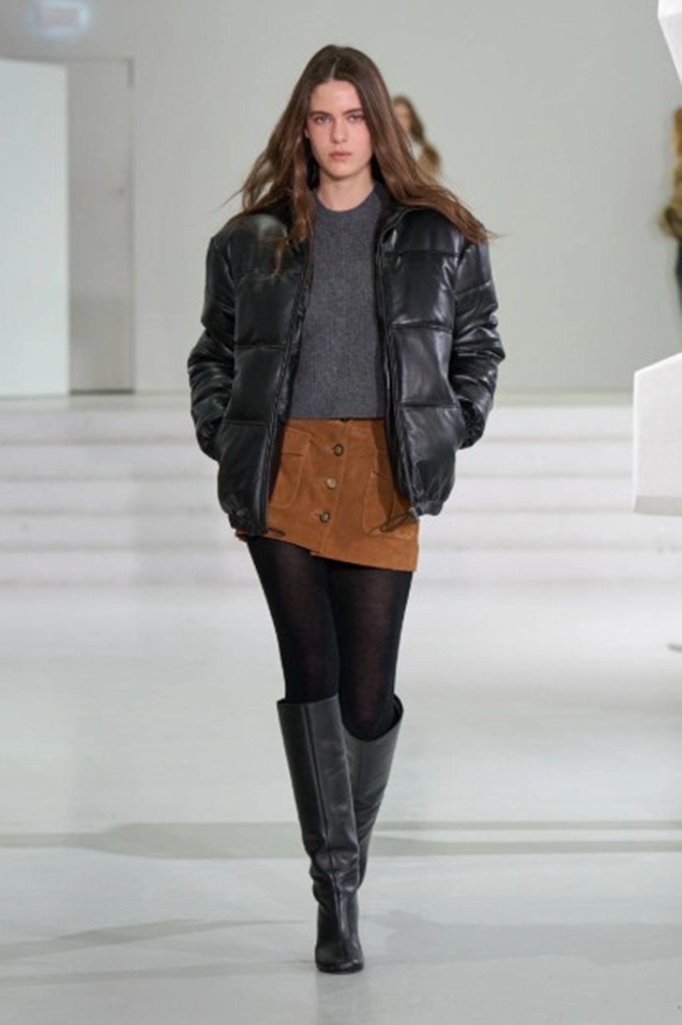 model wearing the garment como tee on the AW25 runway