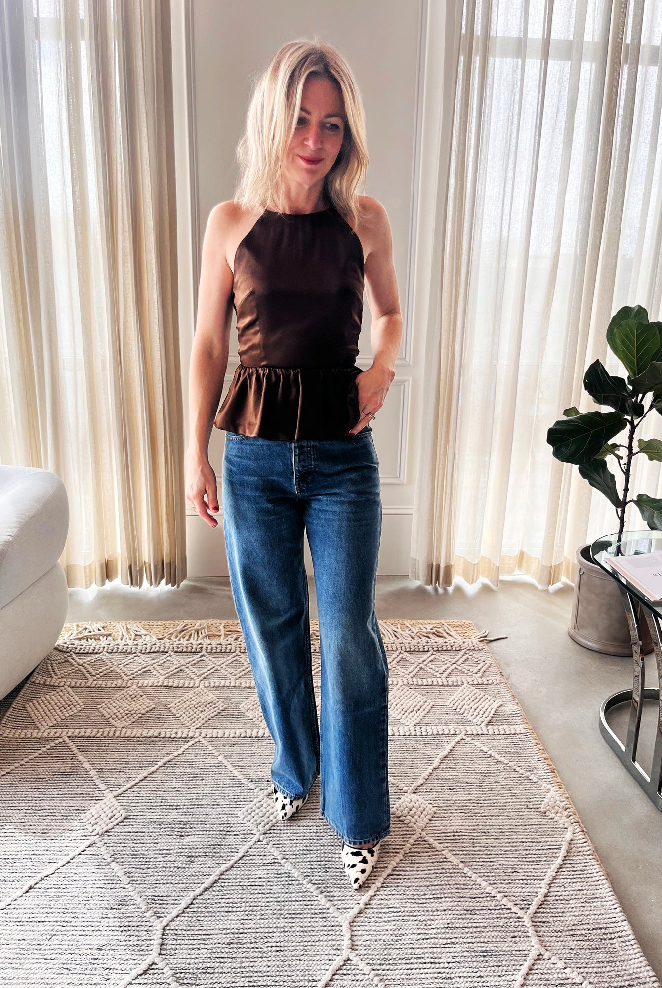 image of a woman wearing the Garment Tie Back top and Sablyn Sammy Jeans