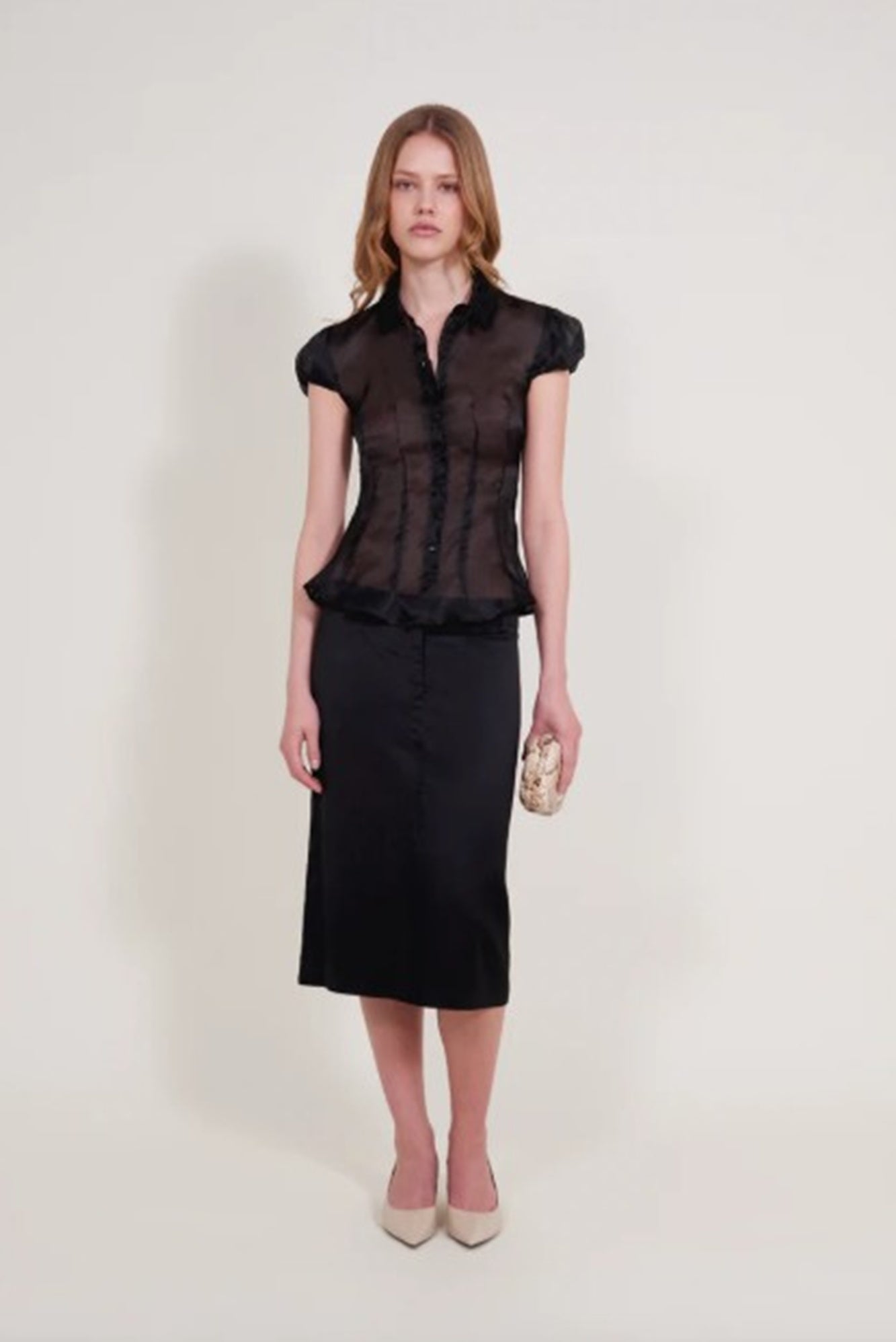 image of a model wearing the Alfie Abby shirt and Erin skirt in black