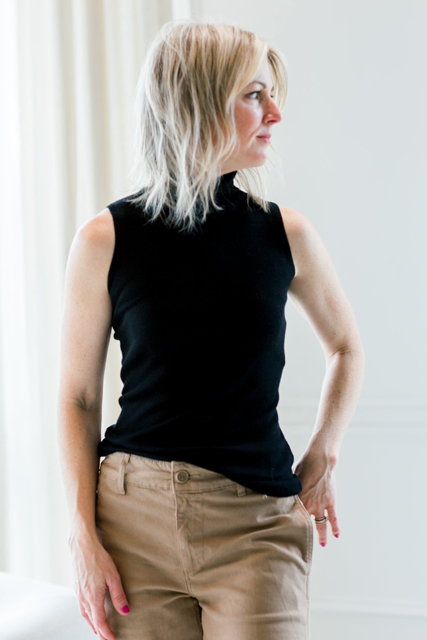 image of a woman wearing the allude turtleneck top