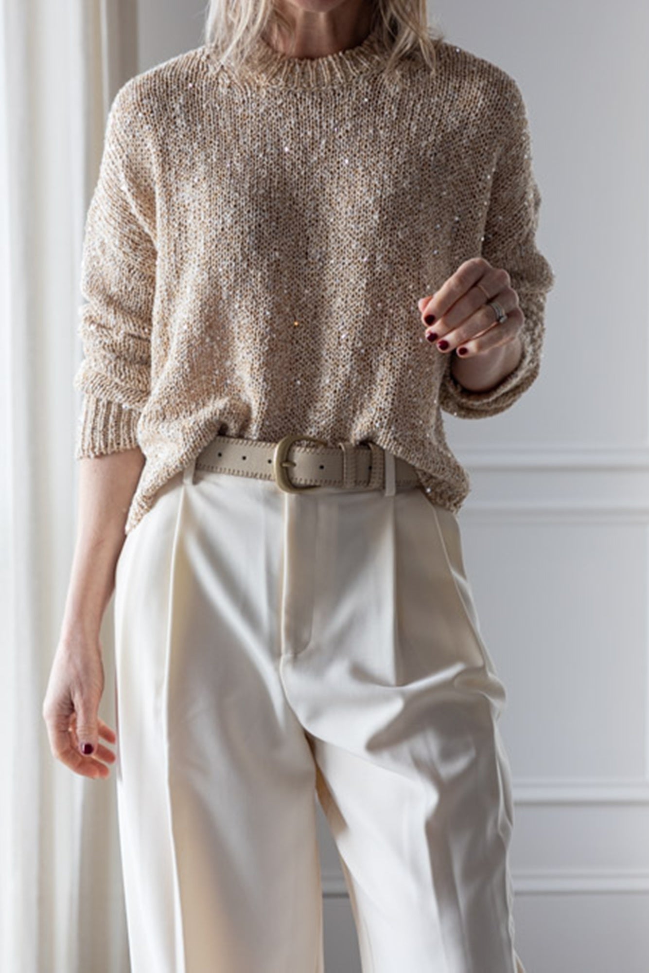 image of a woman wearing the Alysi Sequin Sweater and Seroya Sonya Pants
