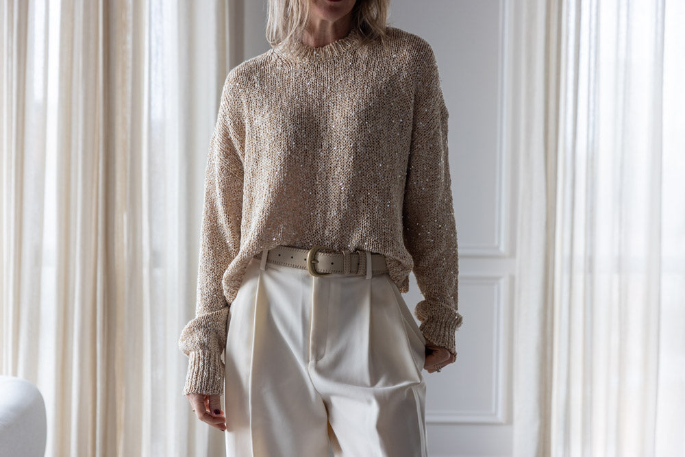 image of a woman wearing the Alysi Sequin Sweater and Seroya Sonya Pants