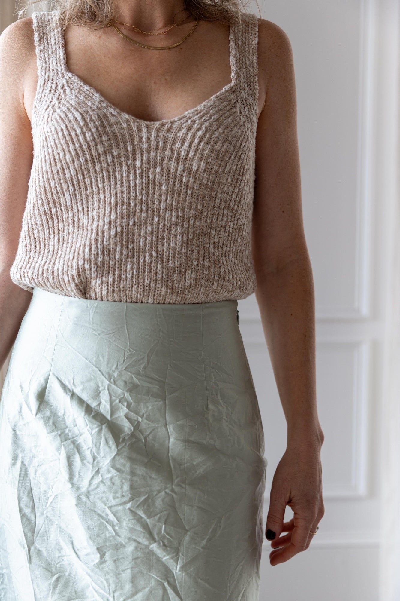 image of a woman wearing the Amo Romy Knit Tank and Rachel Comey Vick Skirt