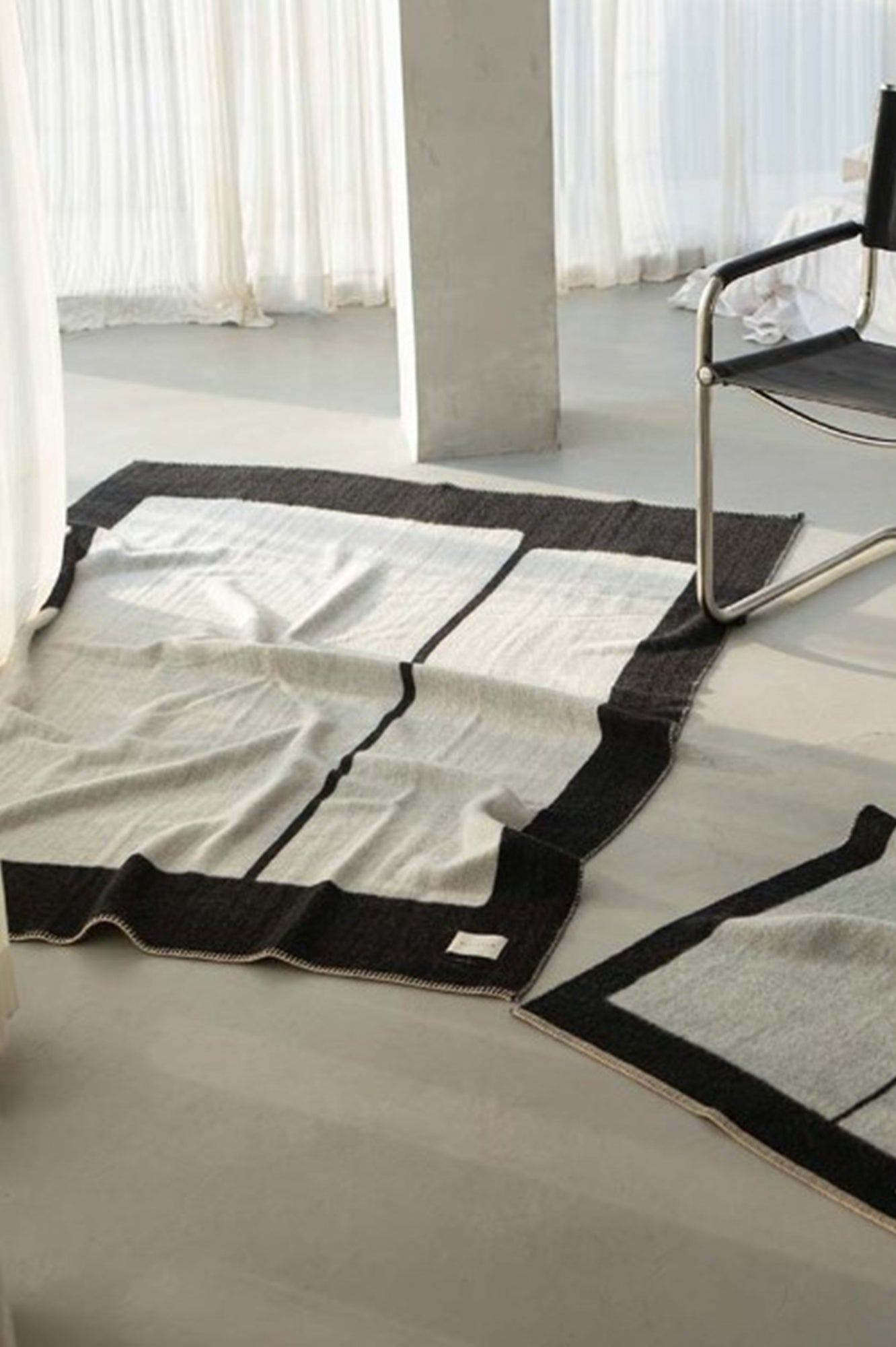 Modern rug with geometric pattern on a light-colored floor