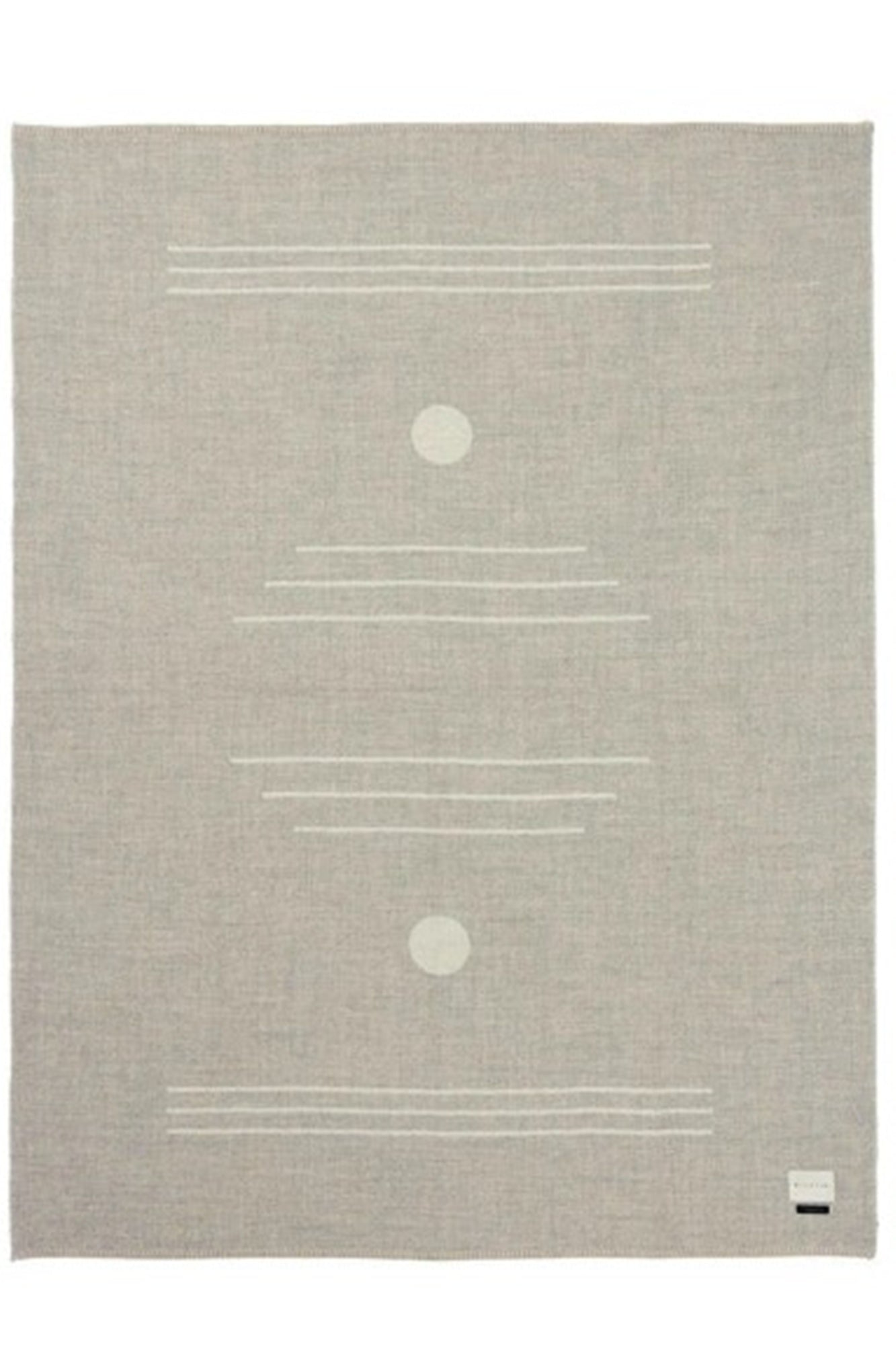 Textured rug with minimalistic design on a plain background