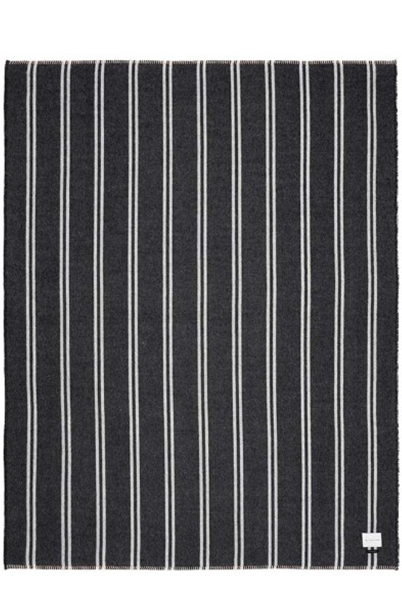 Black and white striped fabric with a visible brand label on a white background