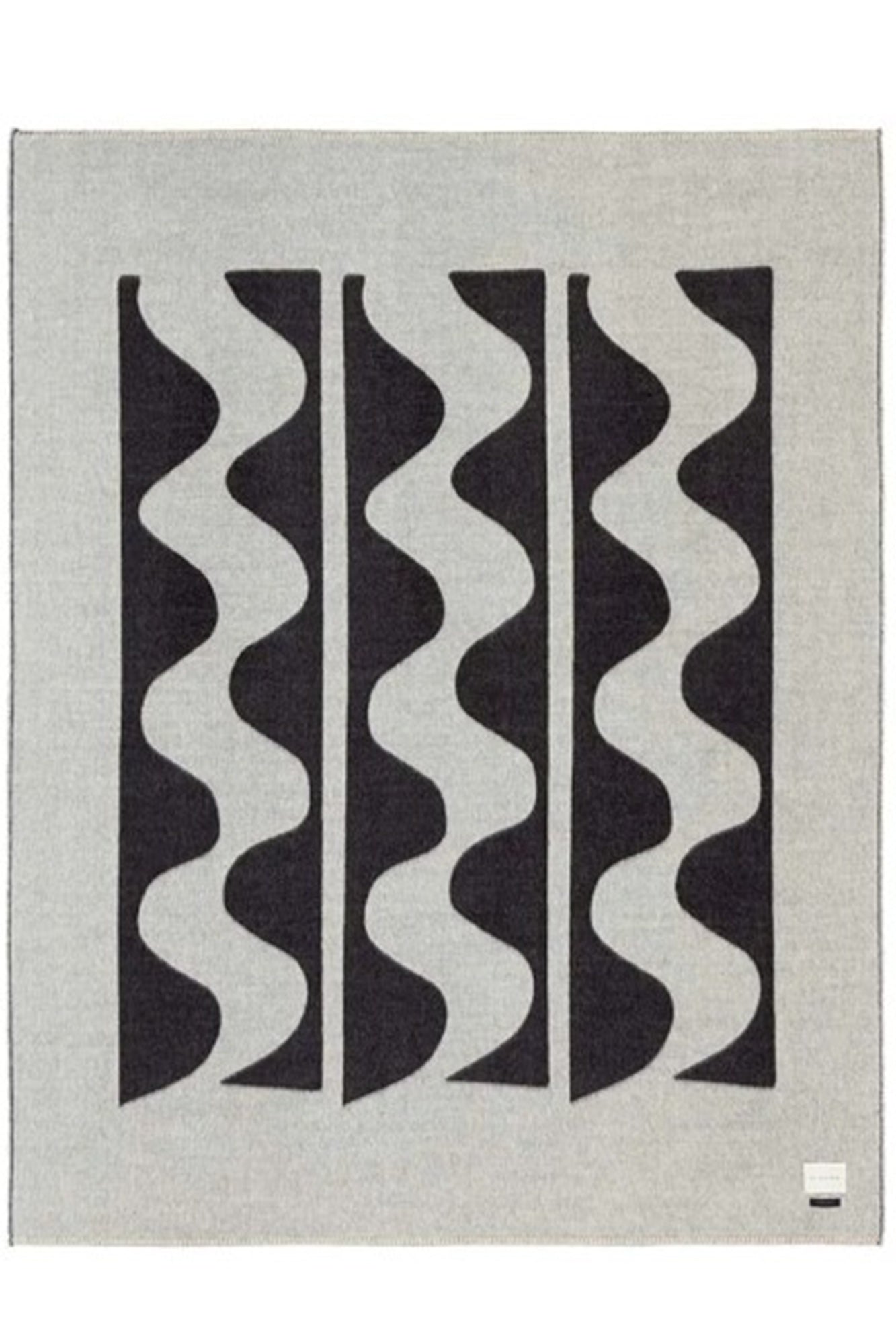 Rug with wavy pattern on a plain background