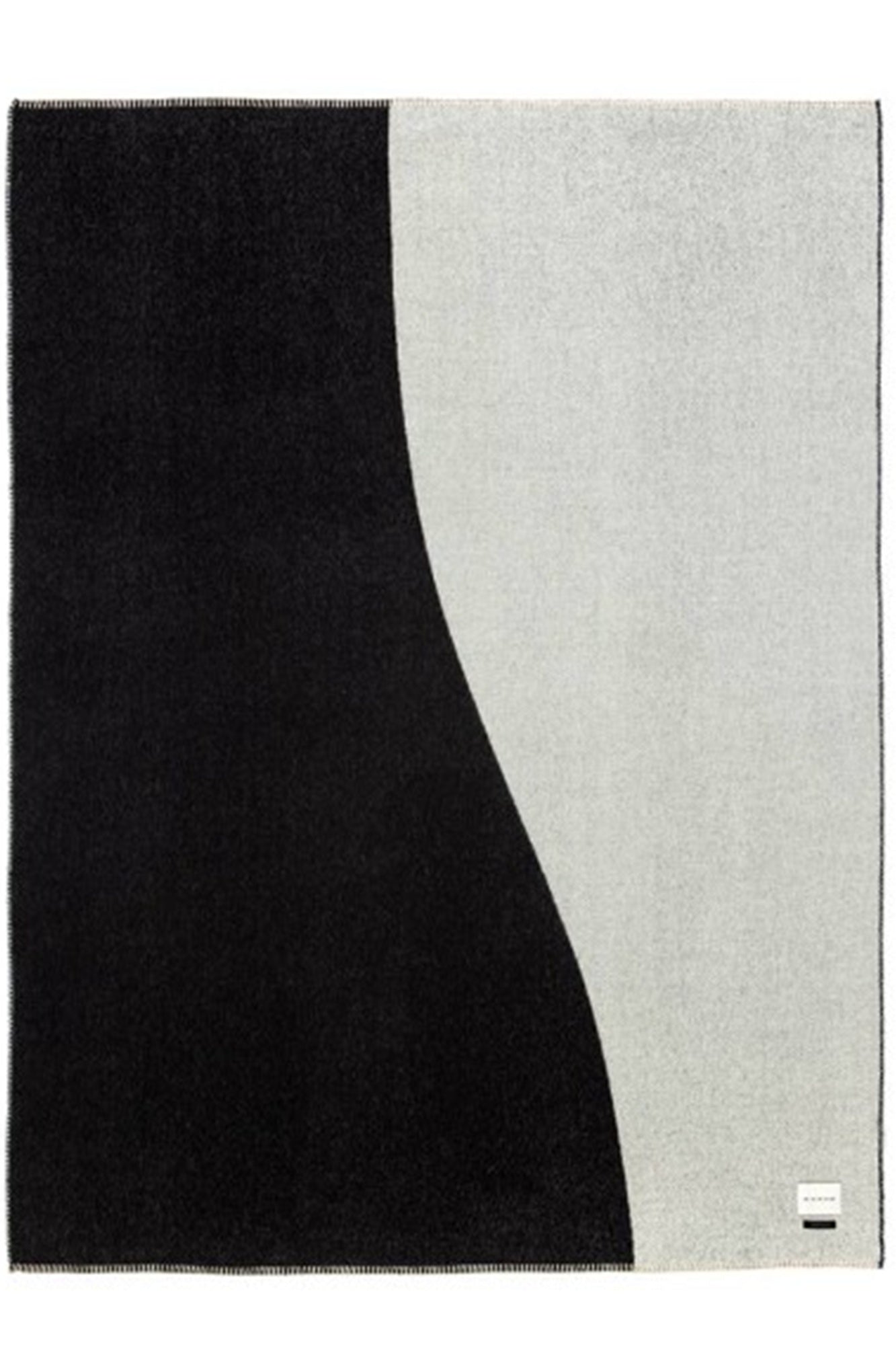 Black and gray rug with a geometric design on a white background