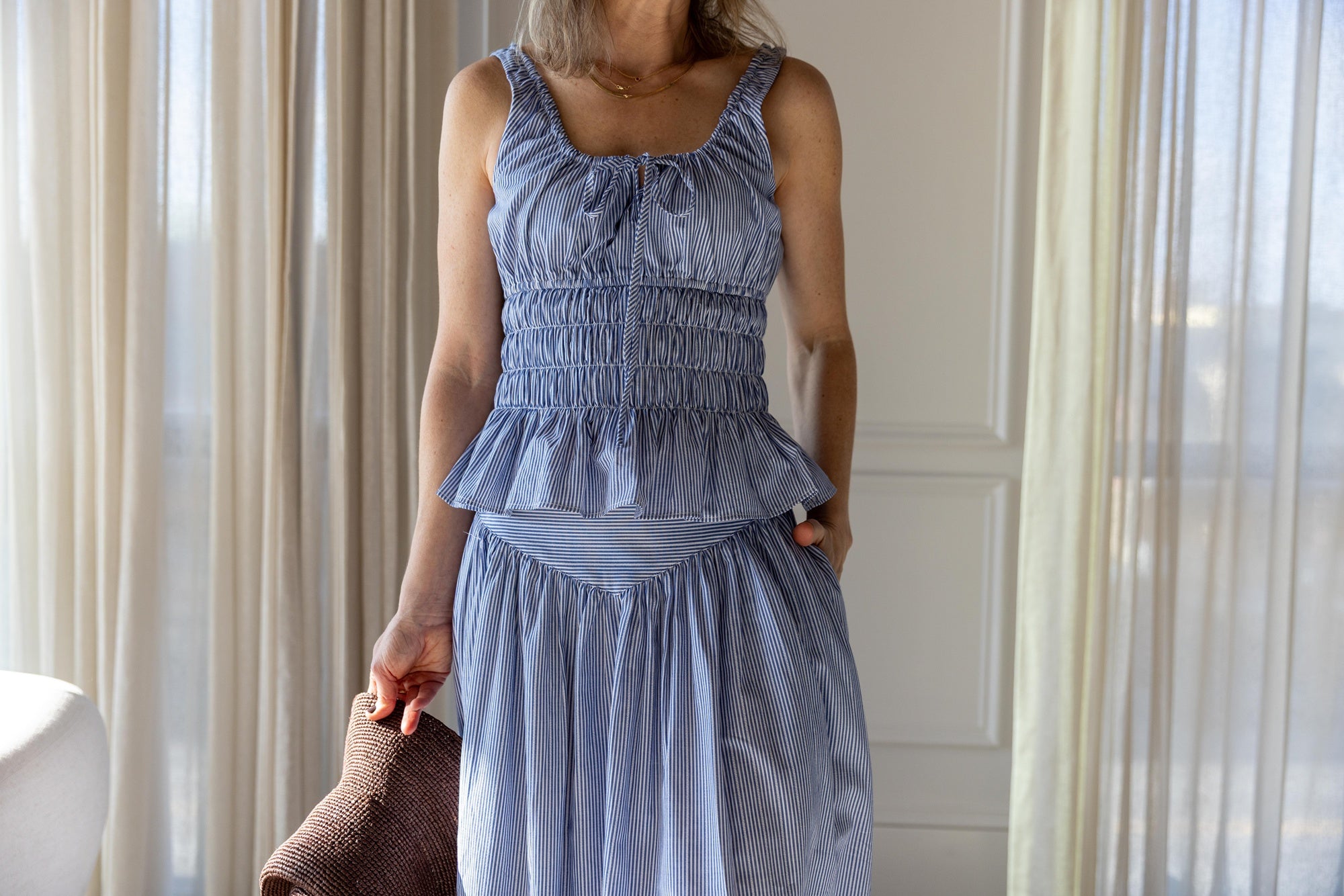 image of a woman wearing the Ciao Lucia Gigi Top and Zoe Skirt