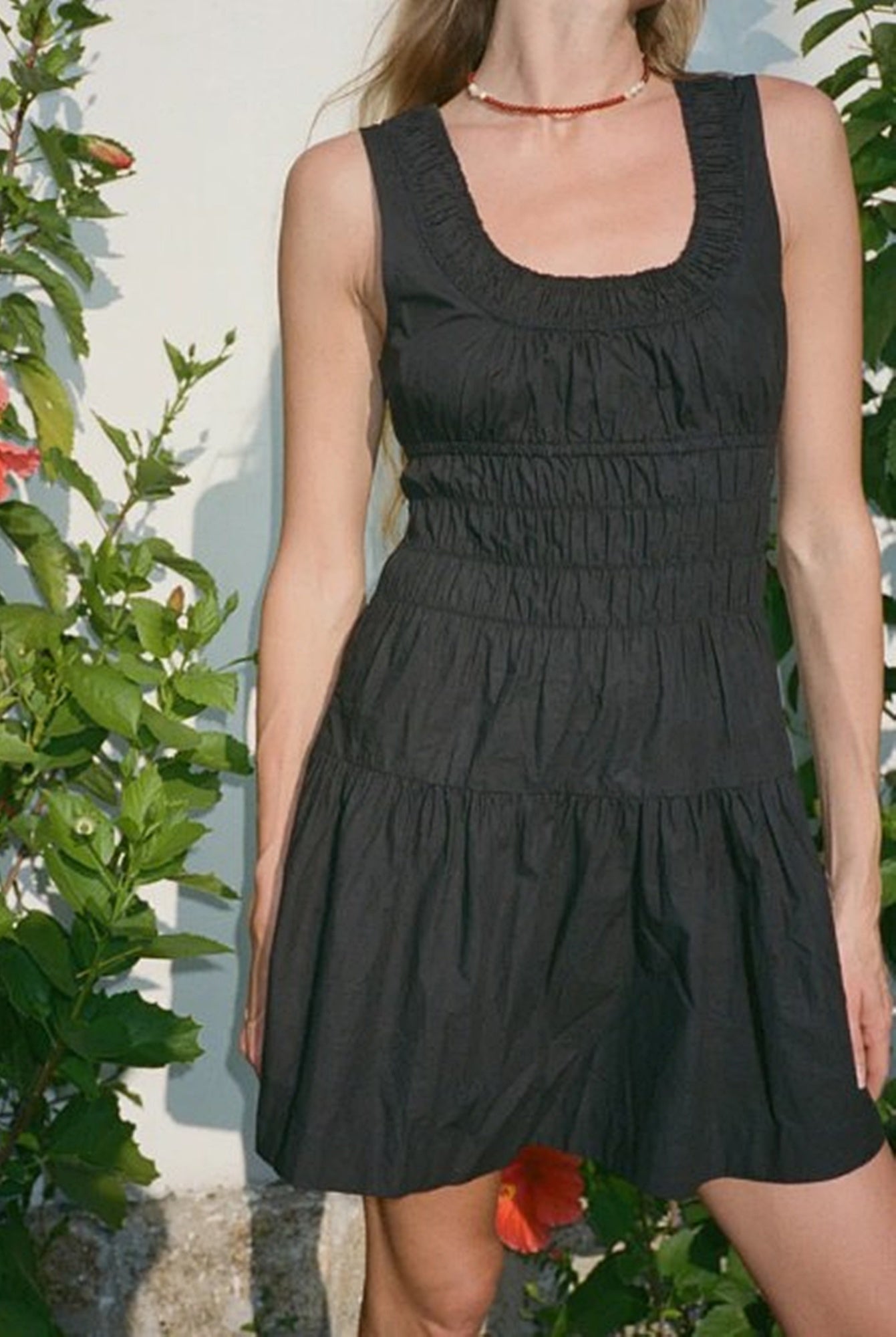 image of a model wearing the Ciao Lucia Kala Dress in Black
