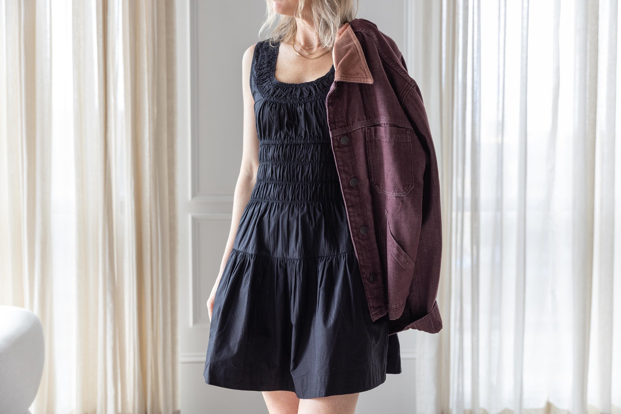 image of a woman wearing the Ciao Lucia Kala dress and Jeanerica Nua Denim Jacket