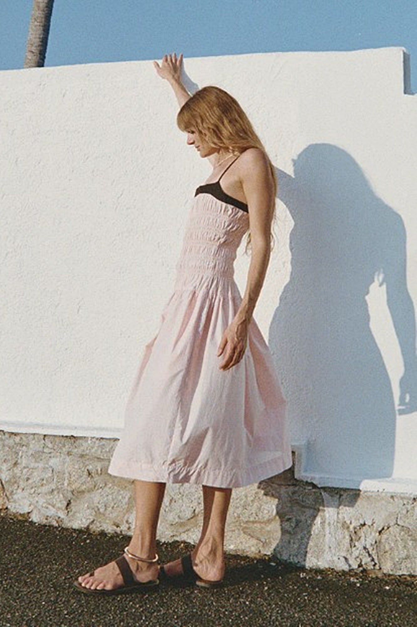 image of a woman wearing the Ciao Lucia Rosella Dress in Powder Pink