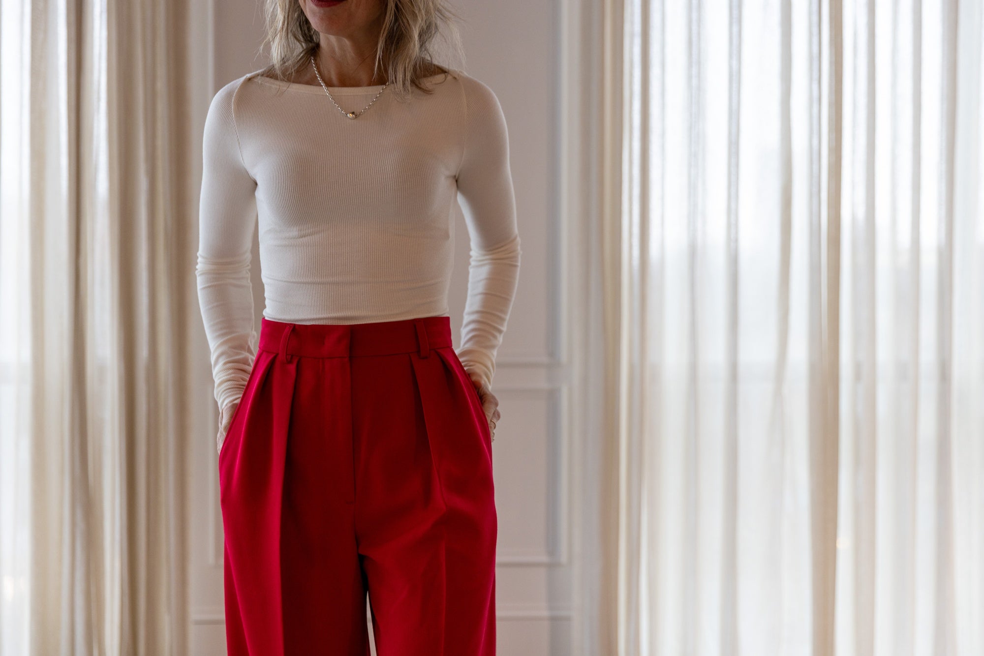 image of a woman wearing the Eterne Boatneck Tee and Rhune Celine Pants
