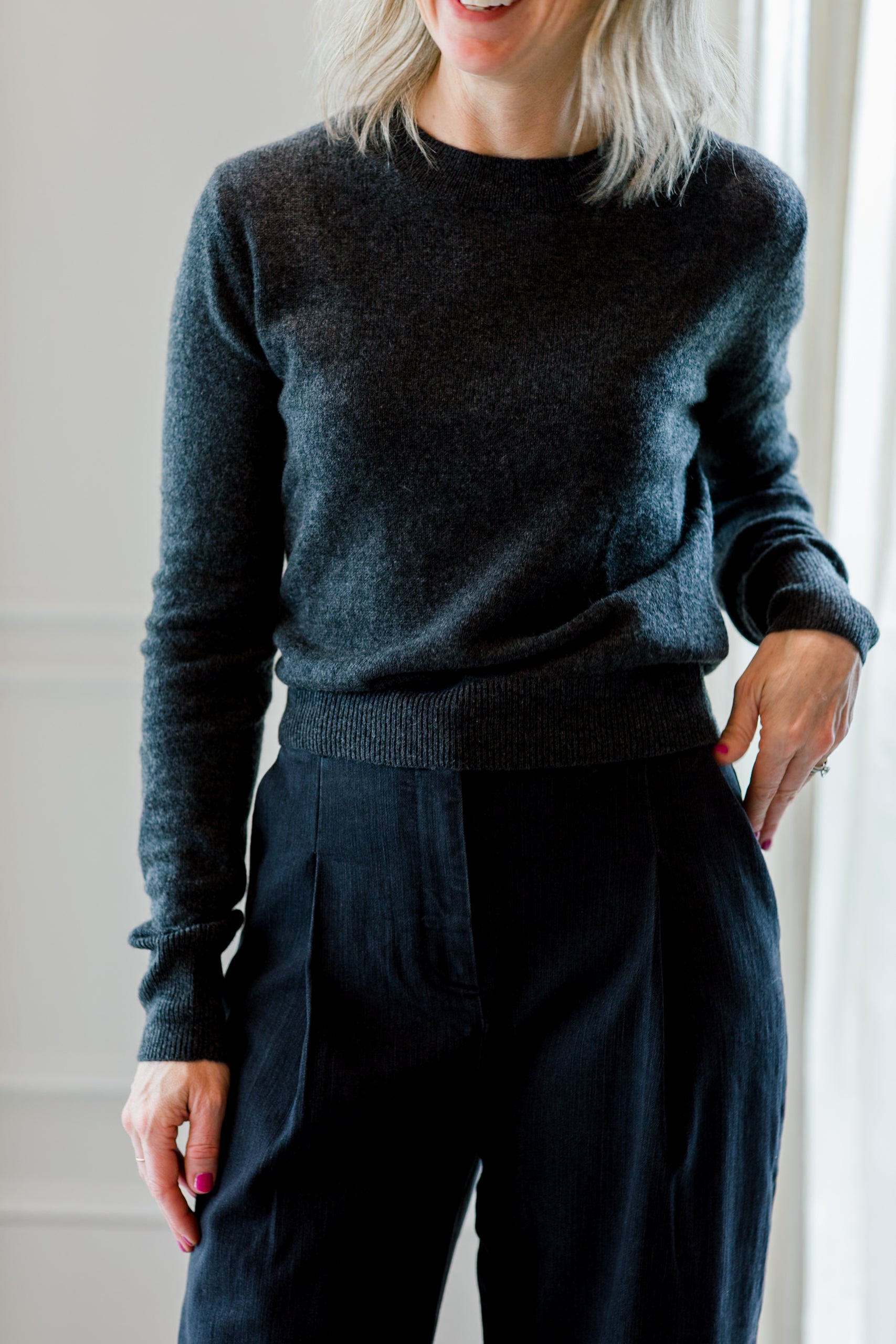 image of a woman wearing the eterne francis sweater in charcoal